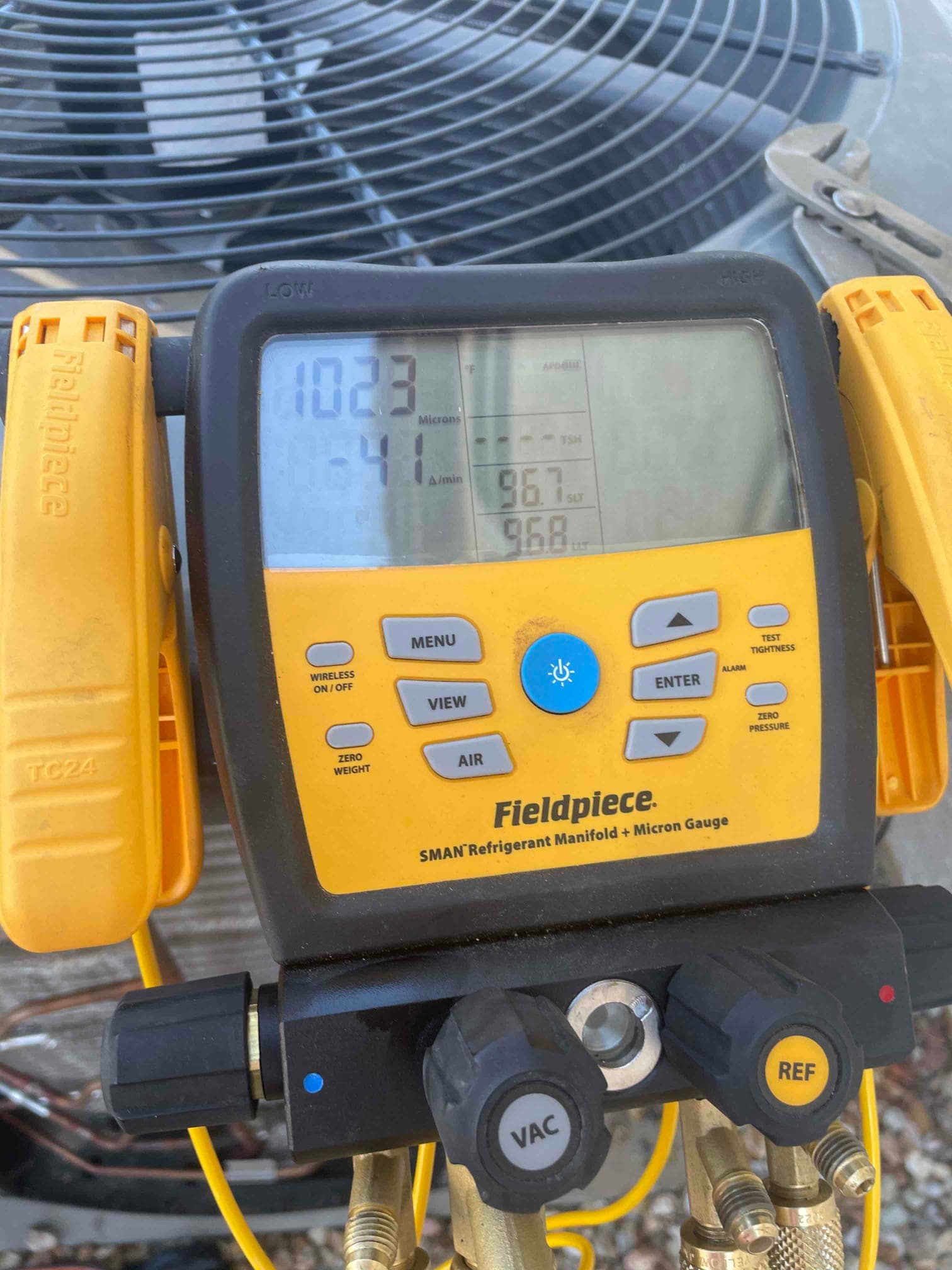Diagnostic instrument display shows 1023 microns.