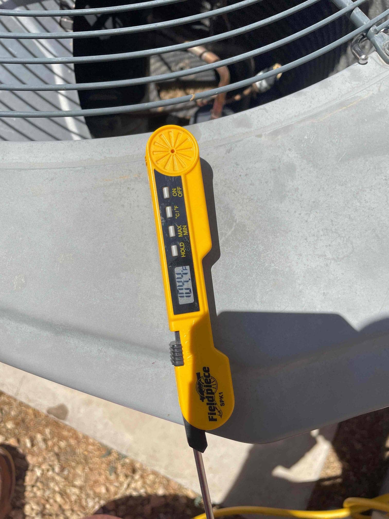 Diagnostic instrument display shows 104.4 °F.