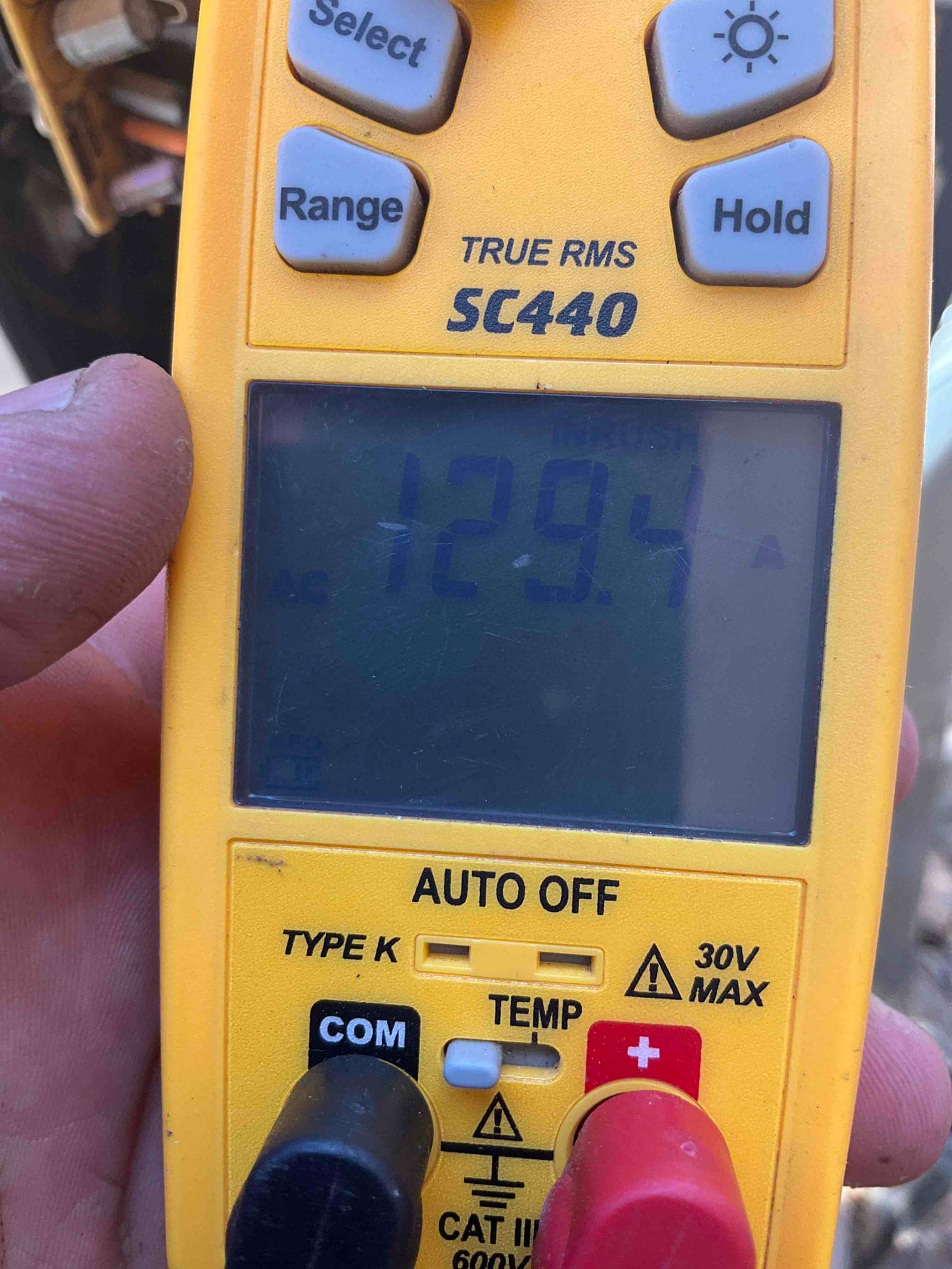 Diagnostic instrument display shows 129.4 A.