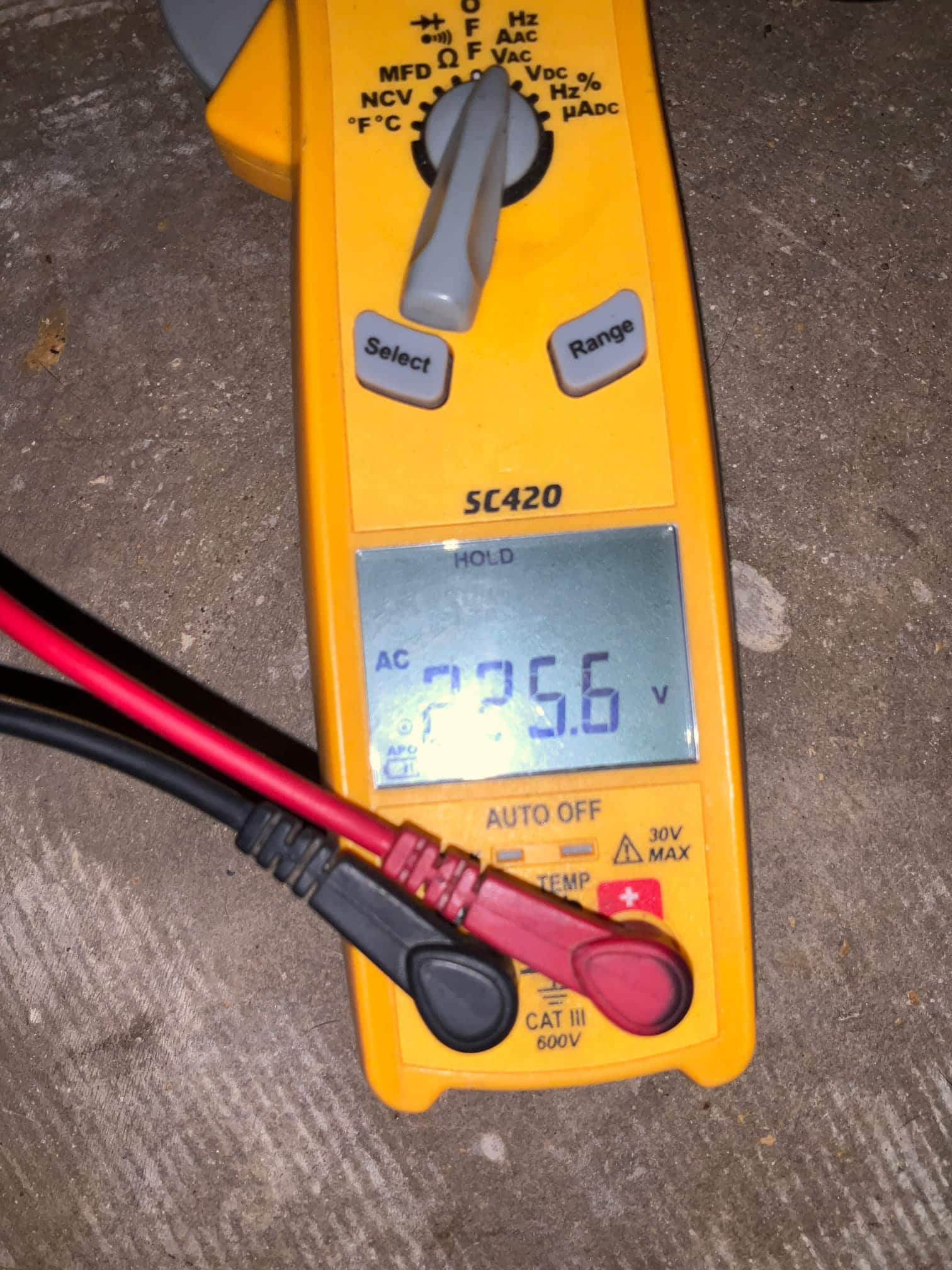 Diagnostic instrument display shows 235.6 V.