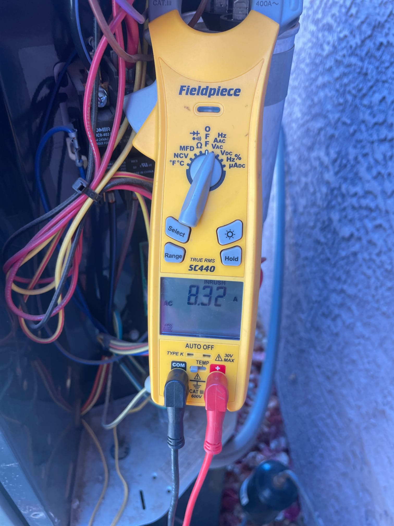 Diagnostic instrument display shows 8.32 A.