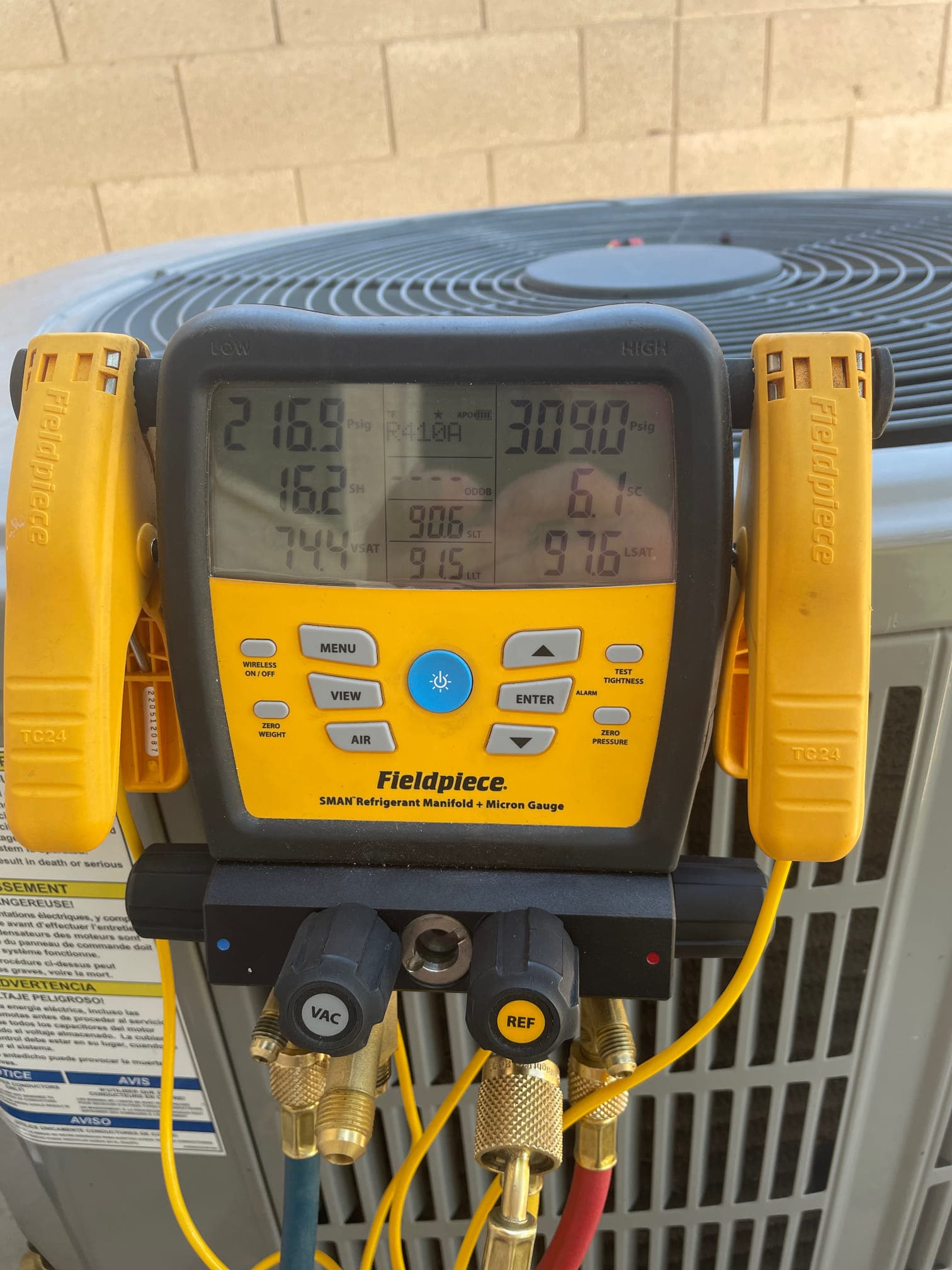 HVAC diagnostic instrument photographed during the service visit.