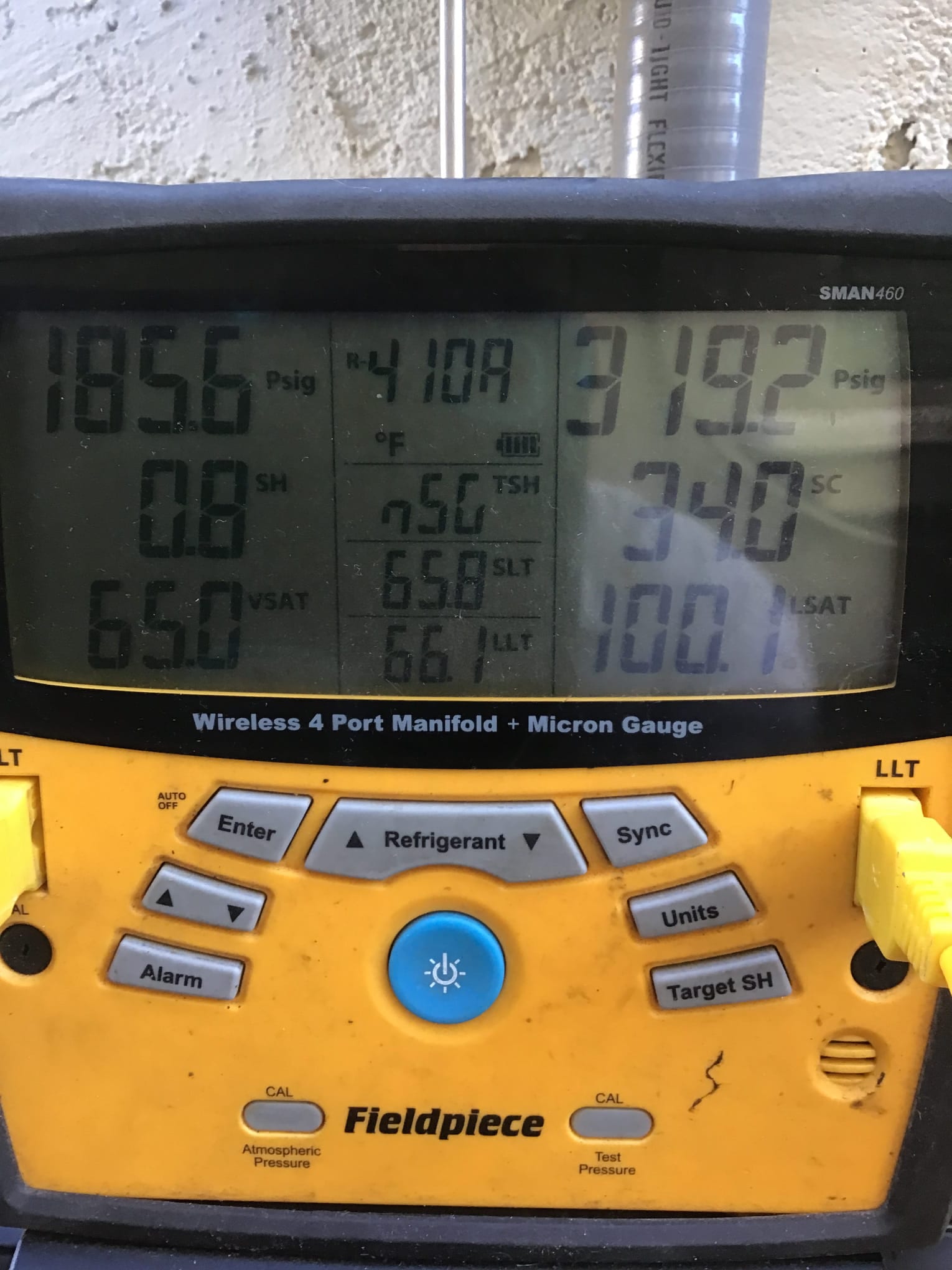 HVAC diagnostic instrument photographed during the service visit.