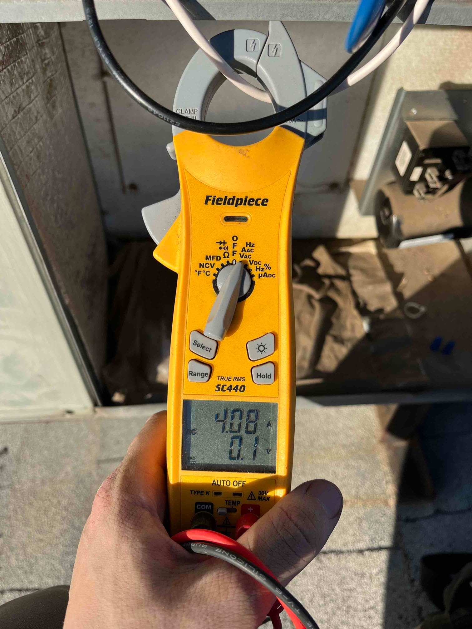 HVAC diagnostic instrument photographed during the service visit.