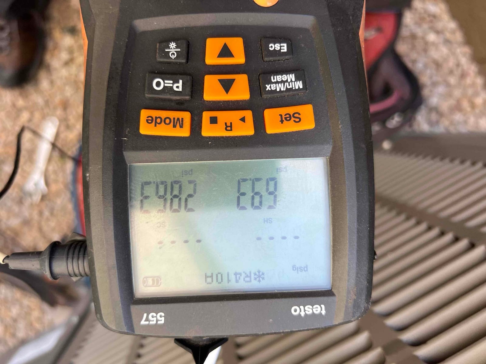 HVAC diagnostic instrument photographed during the service visit.