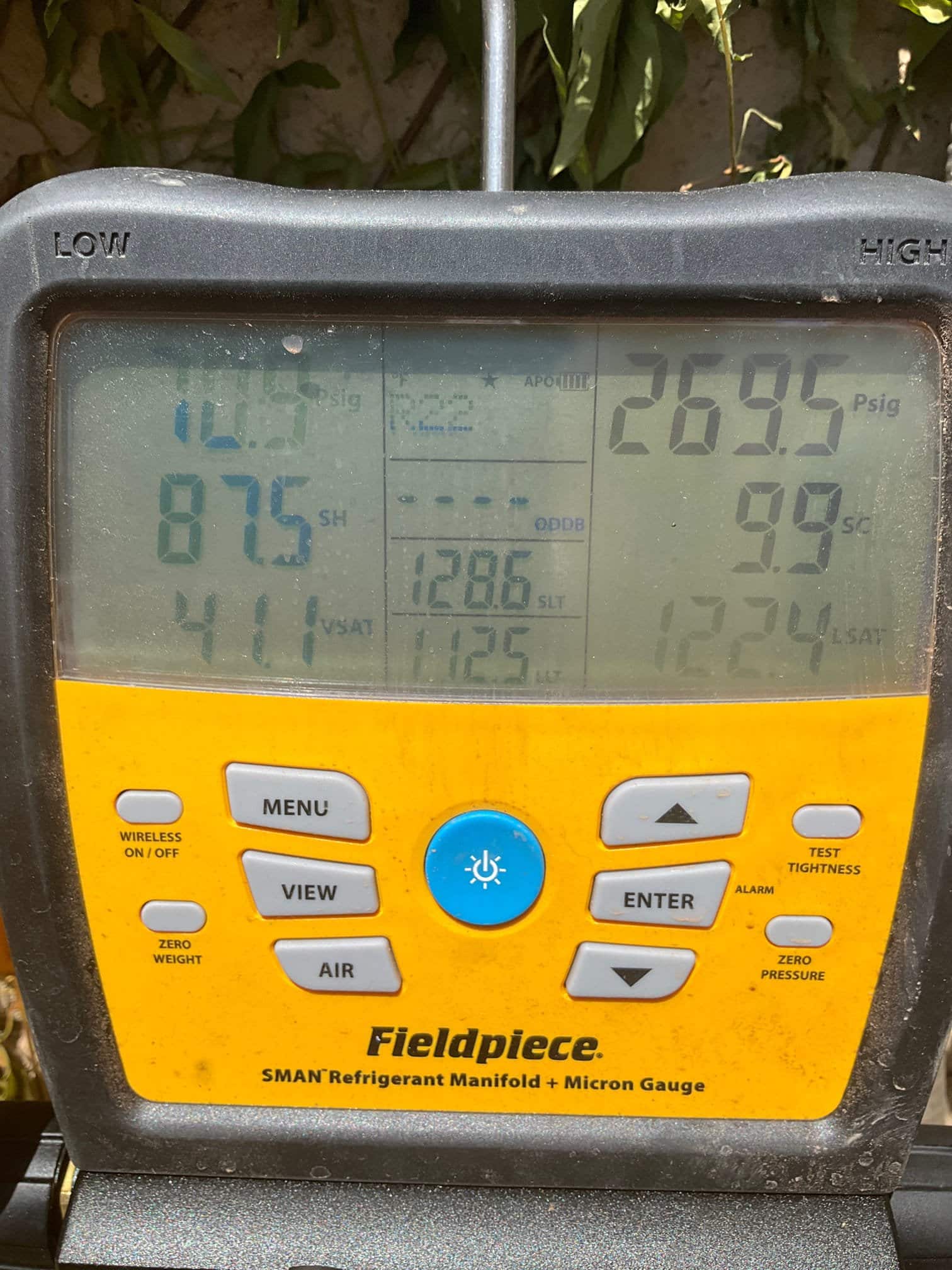 HVAC diagnostic instrument photographed during the service visit.