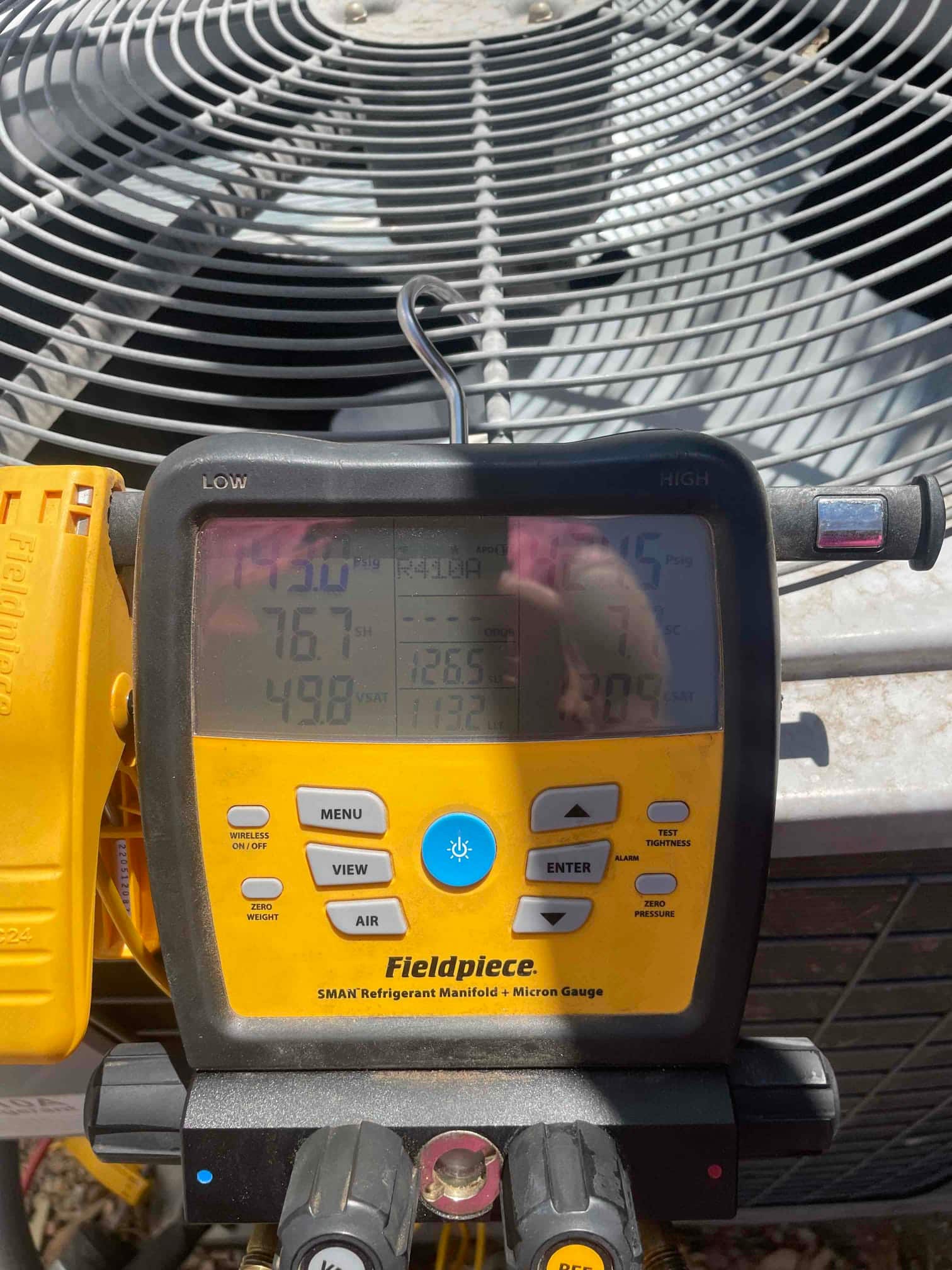 HVAC diagnostic instrument photographed during the service visit.