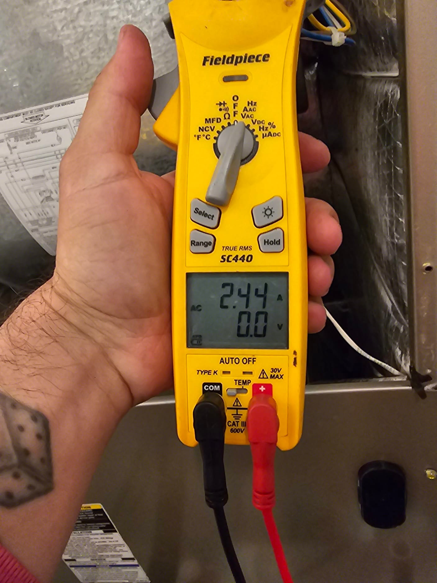 HVAC diagnostic instrument photographed during the service visit.