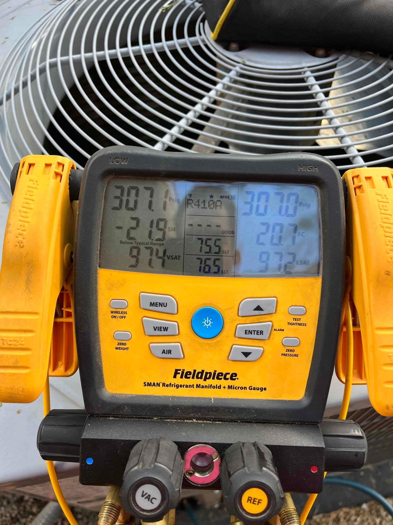 HVAC diagnostic instrument photographed during the service visit.