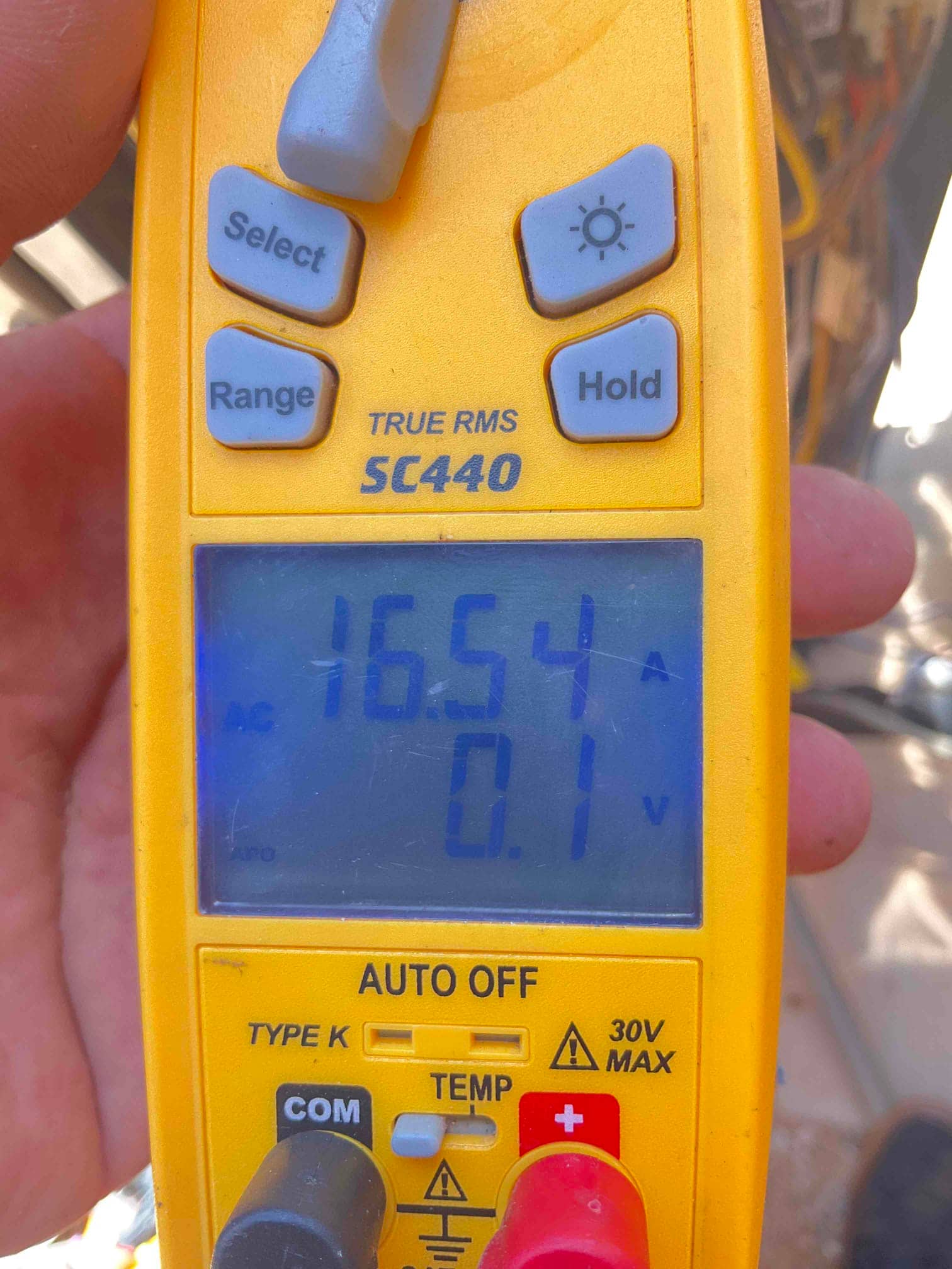 HVAC diagnostic instrument photographed during the service visit.