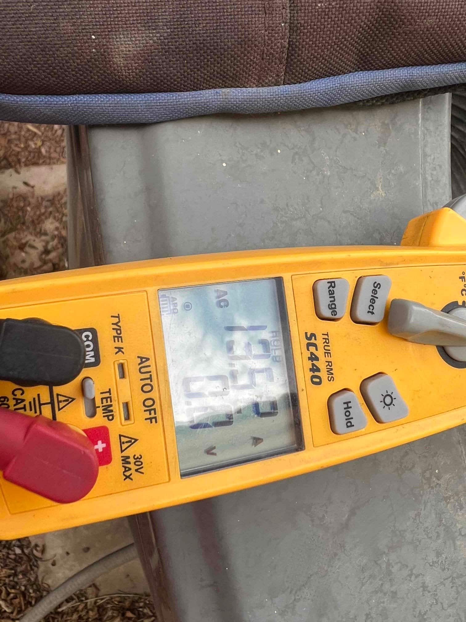HVAC diagnostic instrument photographed during the service visit.