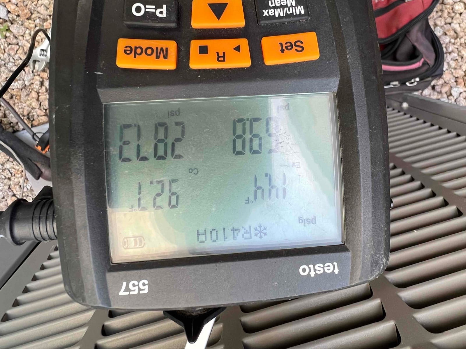 HVAC diagnostic instrument photographed during the service visit.