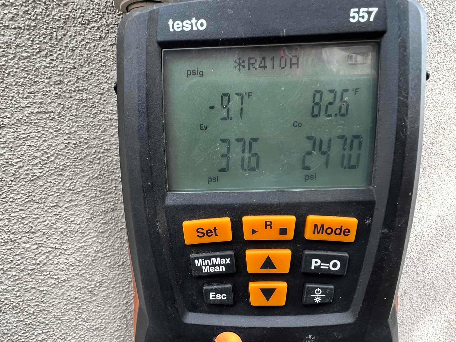 HVAC diagnostic instrument photographed during the service visit.