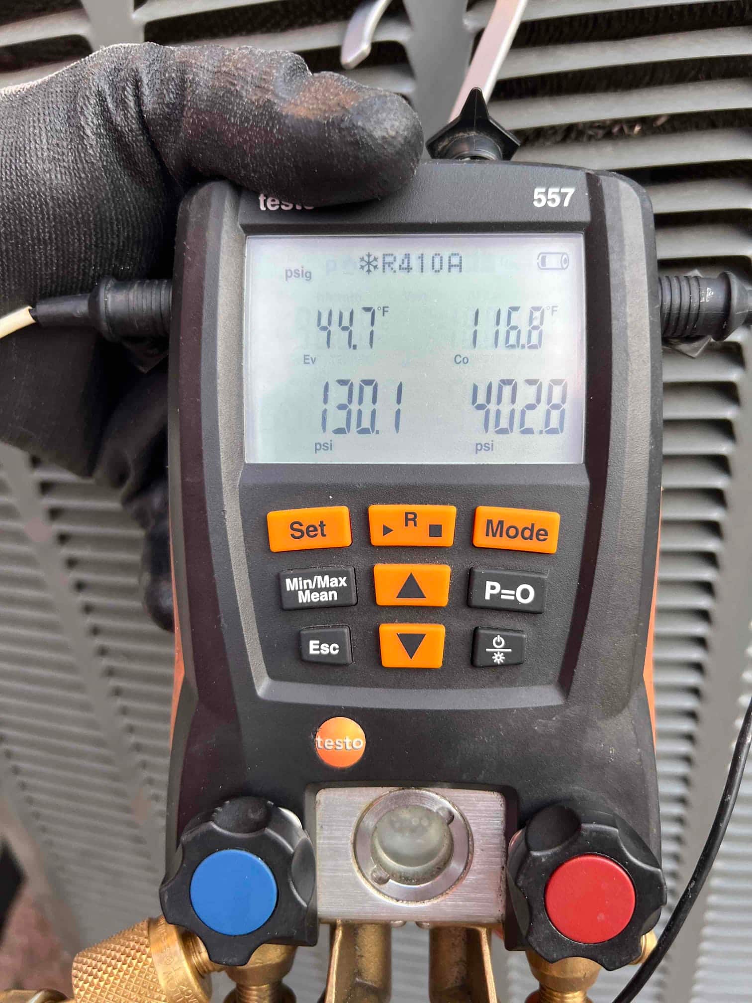 HVAC diagnostic instrument photographed during the service visit.