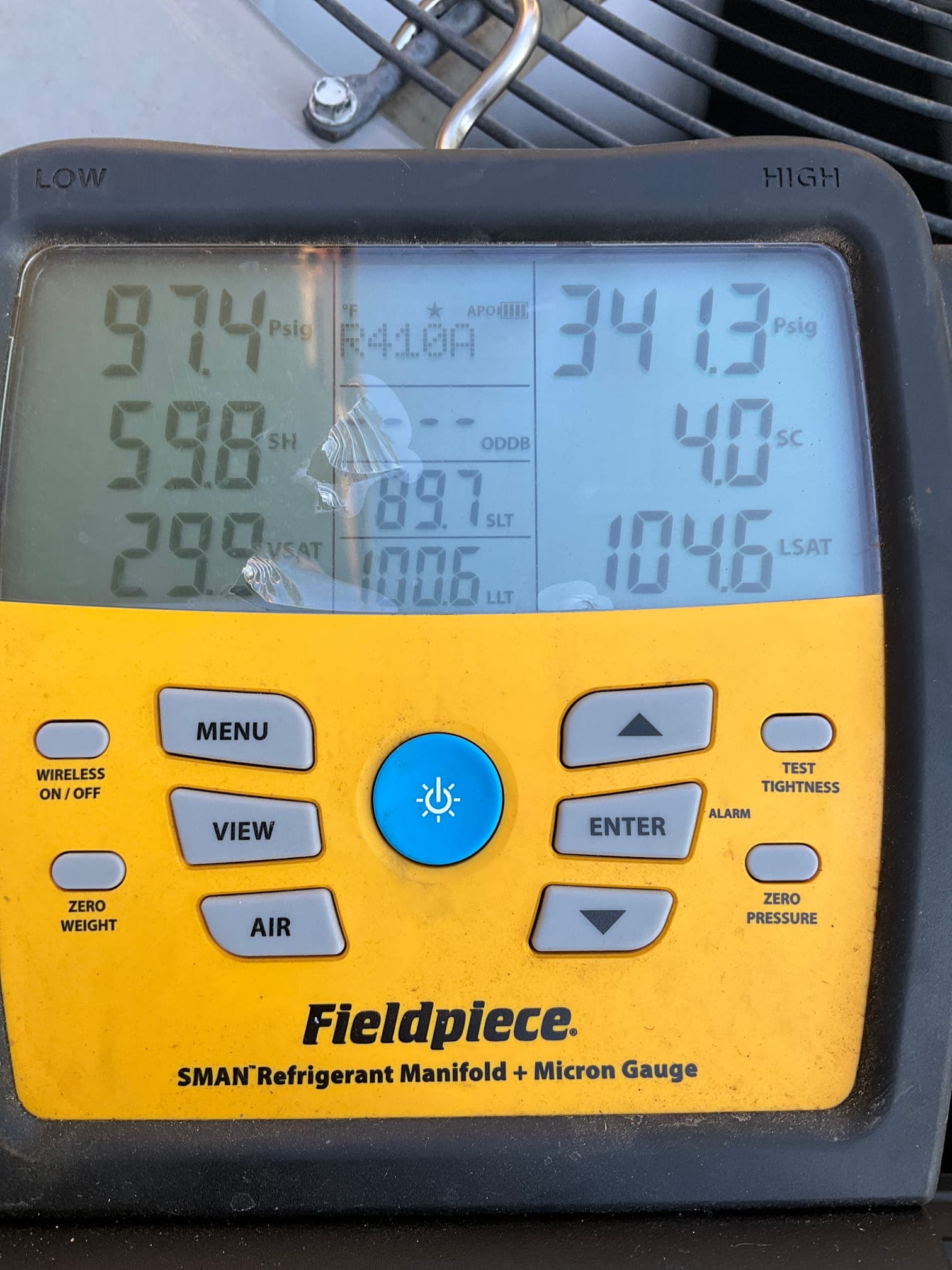 HVAC diagnostic instrument photographed during the service visit.