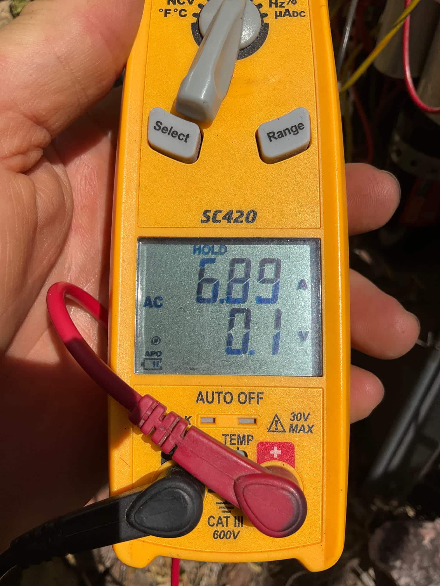 HVAC diagnostic instrument photographed during the service visit.