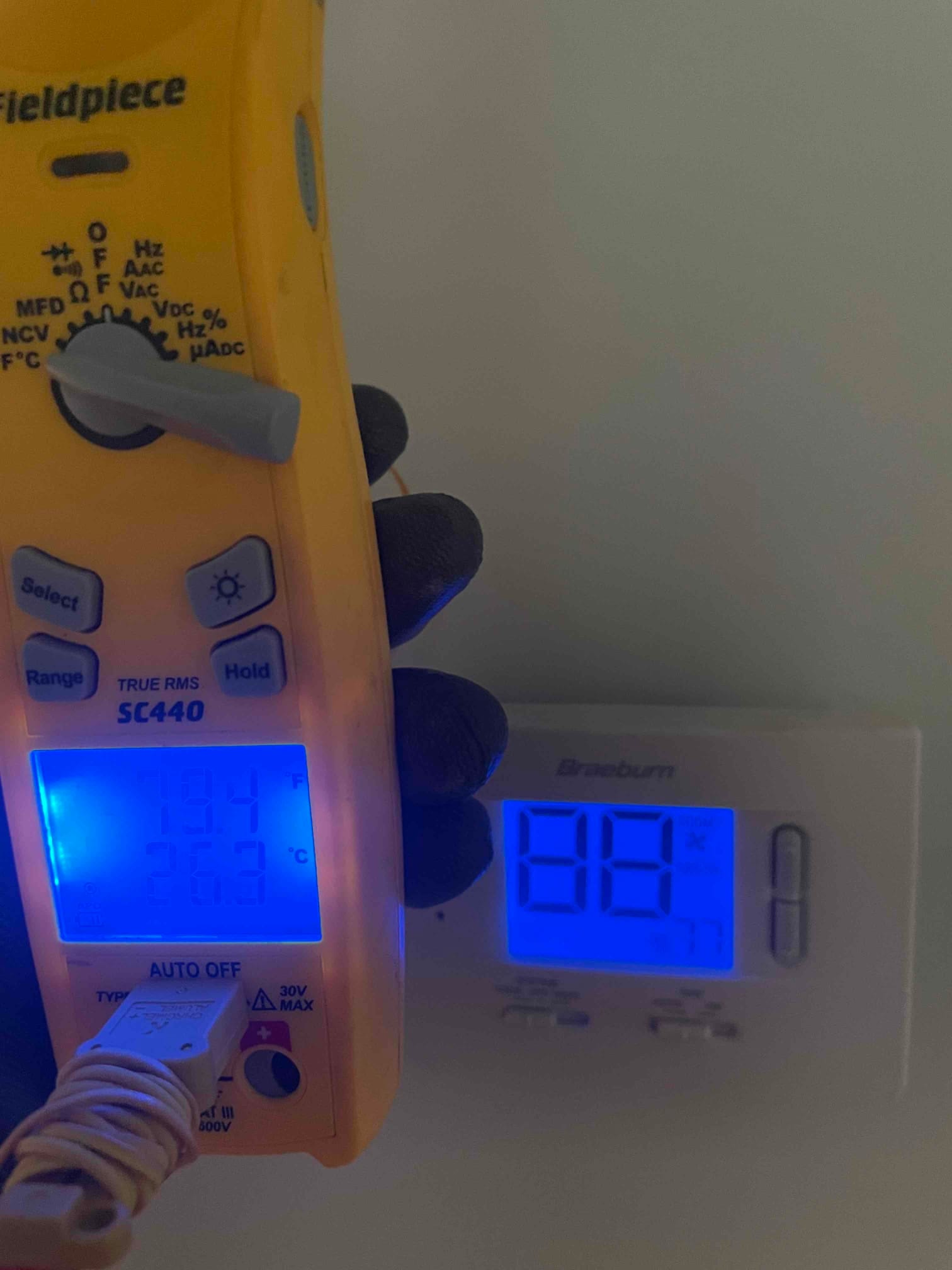 HVAC diagnostic instrument photographed during the service visit.