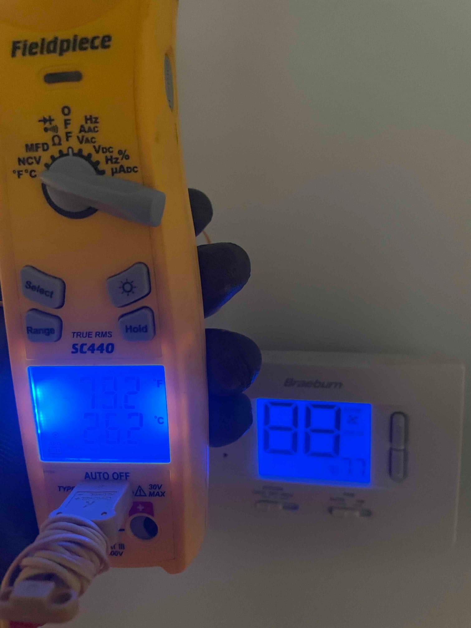 HVAC diagnostic instrument photographed during the service visit.