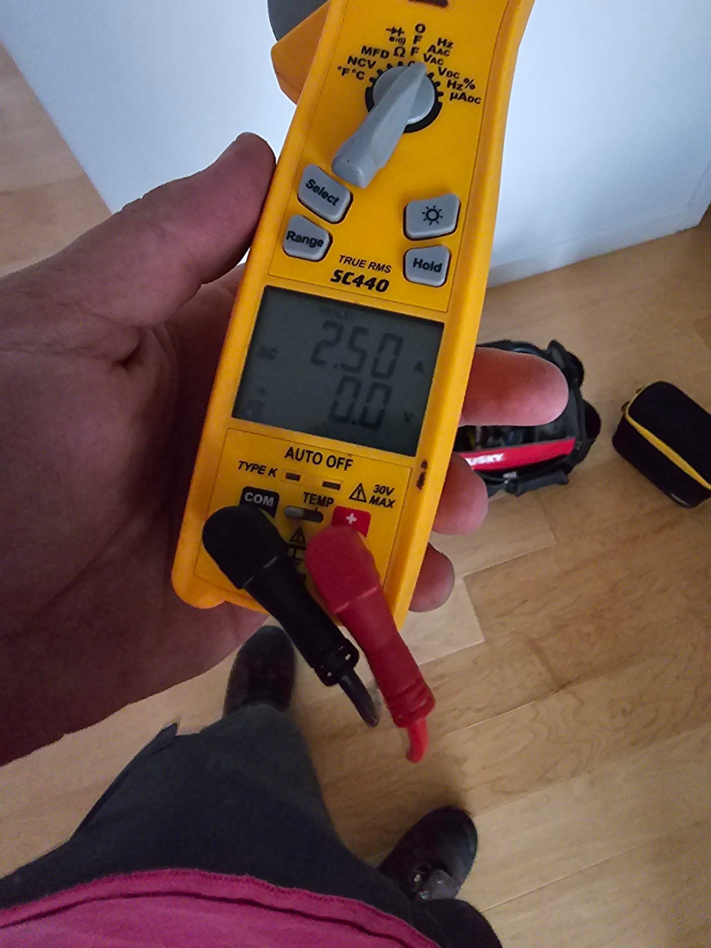 HVAC diagnostic instrument photographed during the service visit.