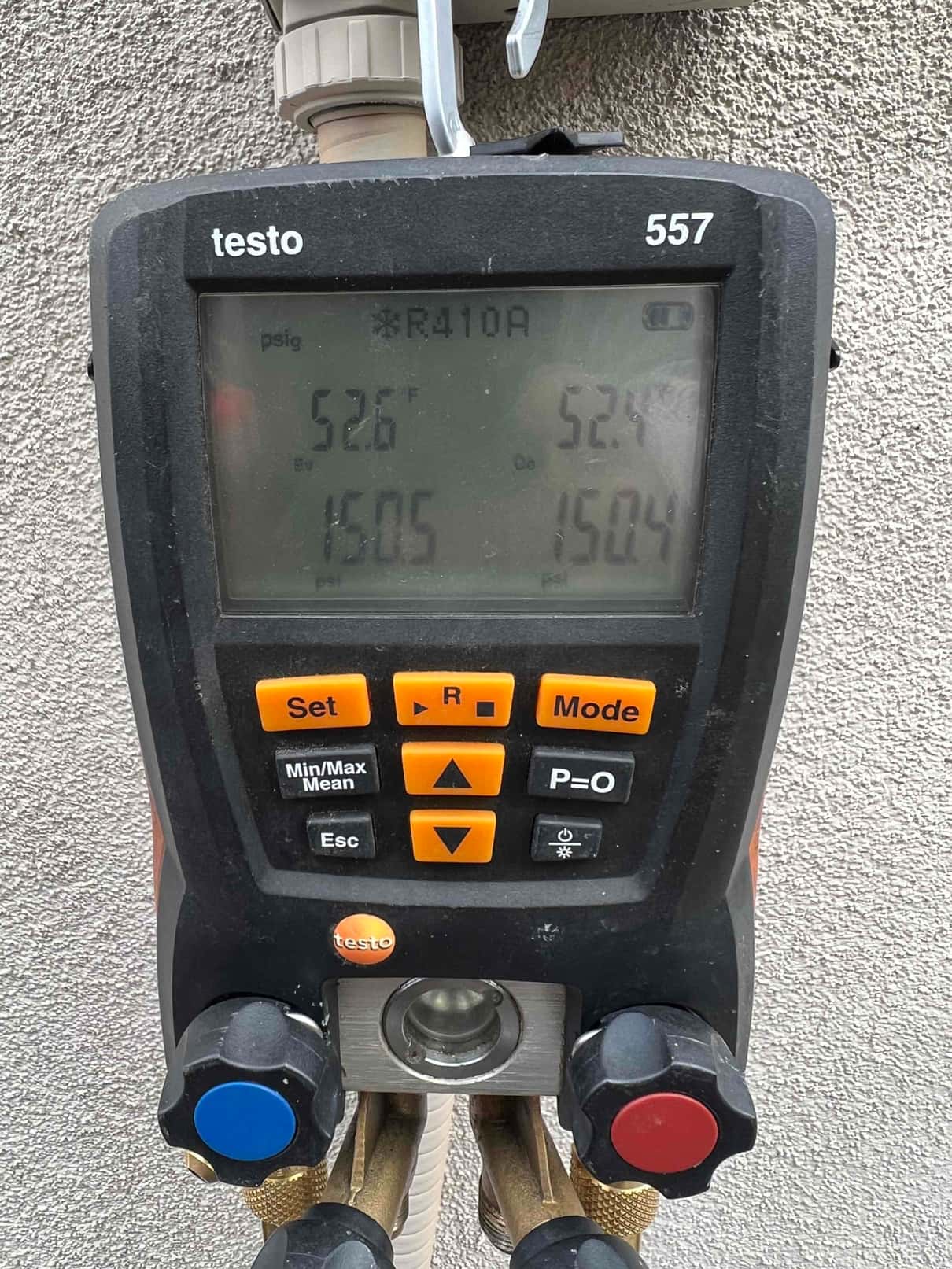 HVAC diagnostic instrument photographed during the service visit.