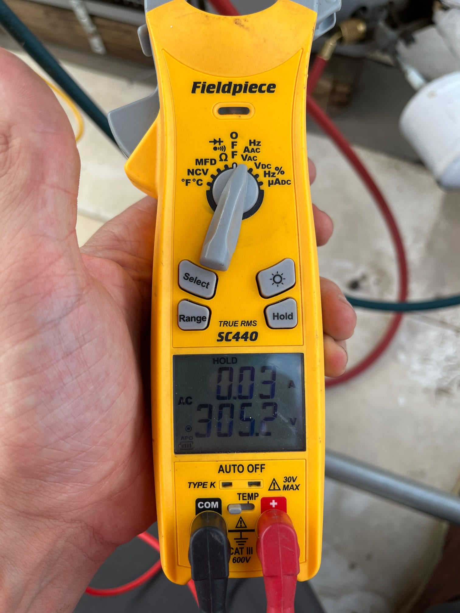 HVAC diagnostic instrument photographed during the service visit.