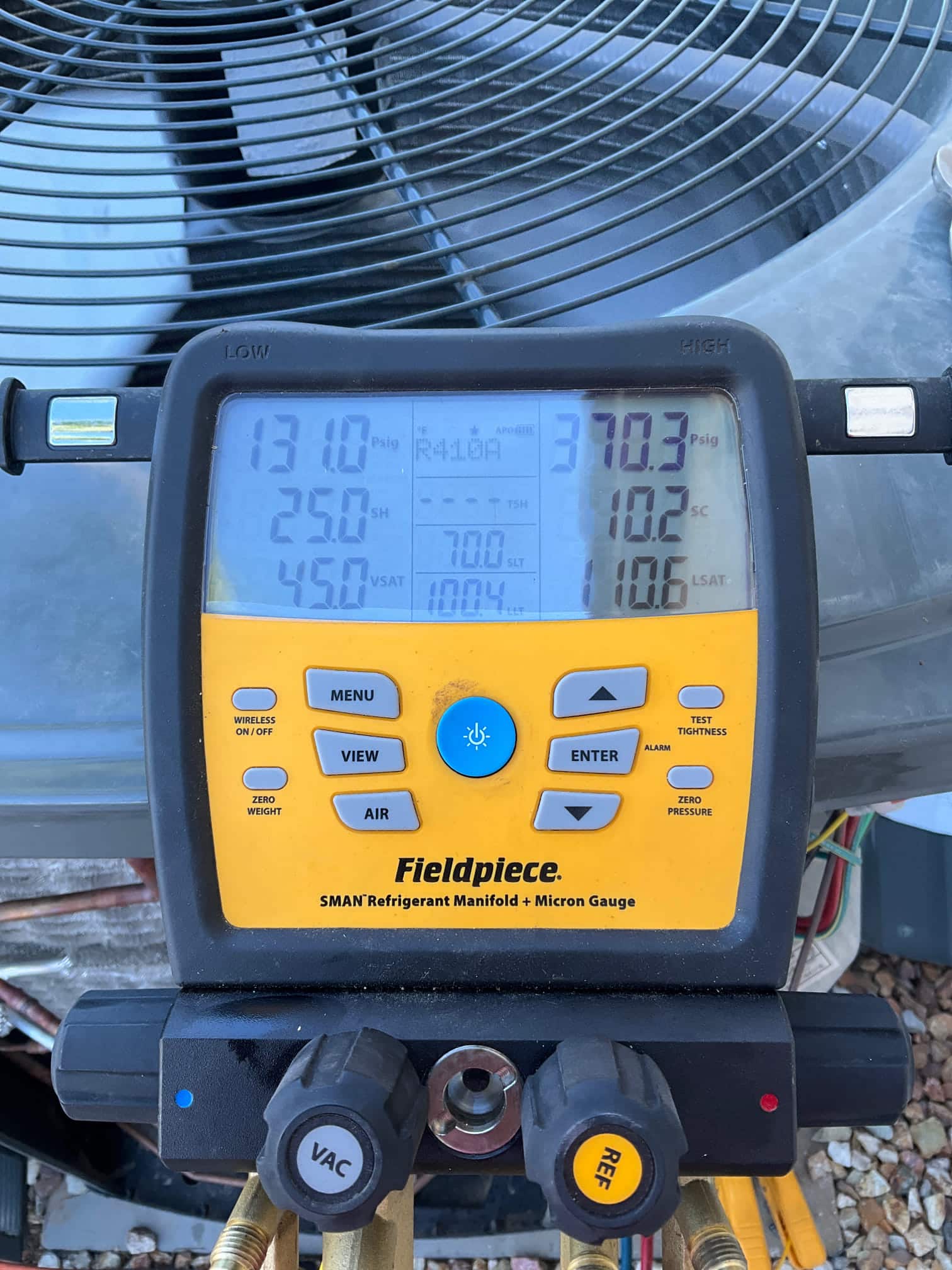 HVAC diagnostic instrument photographed during the service visit.