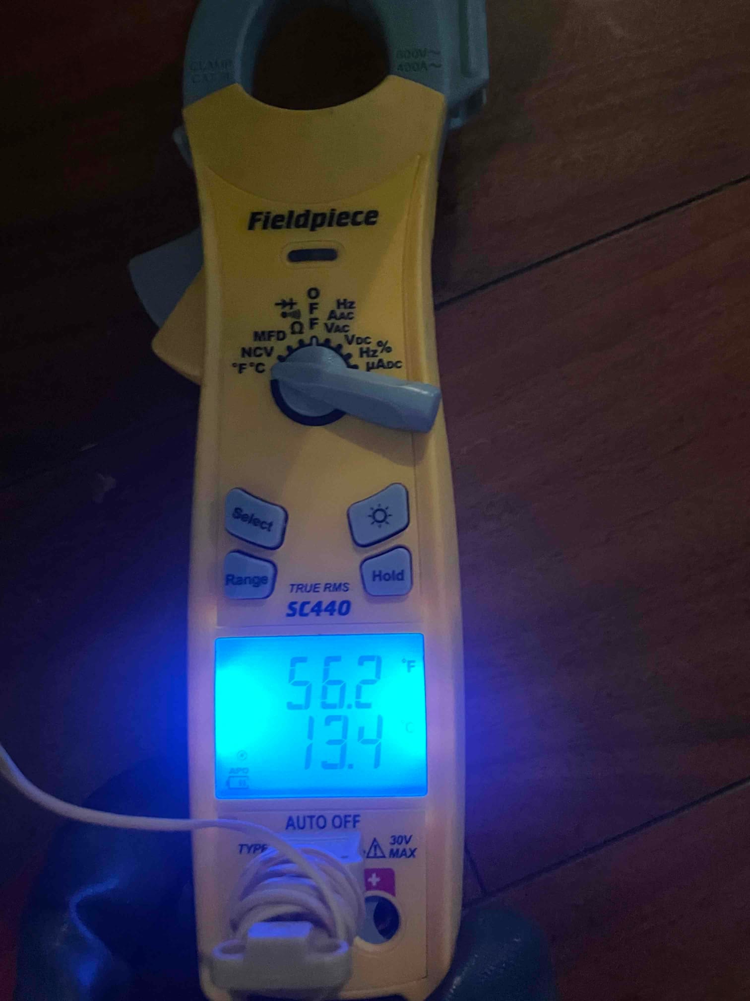 HVAC diagnostic instrument photographed during the service visit.