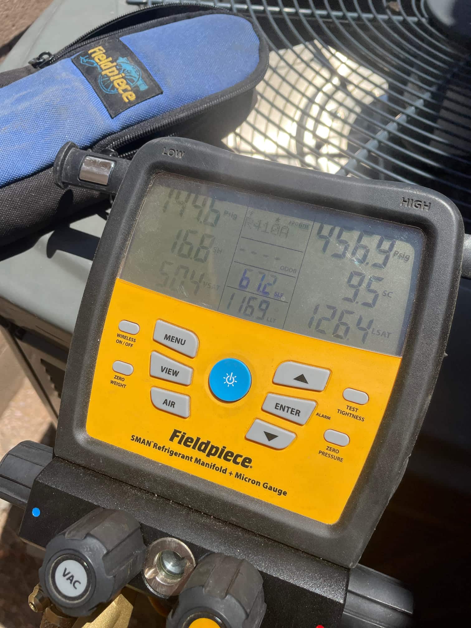 HVAC diagnostic instrument photographed during the service visit.