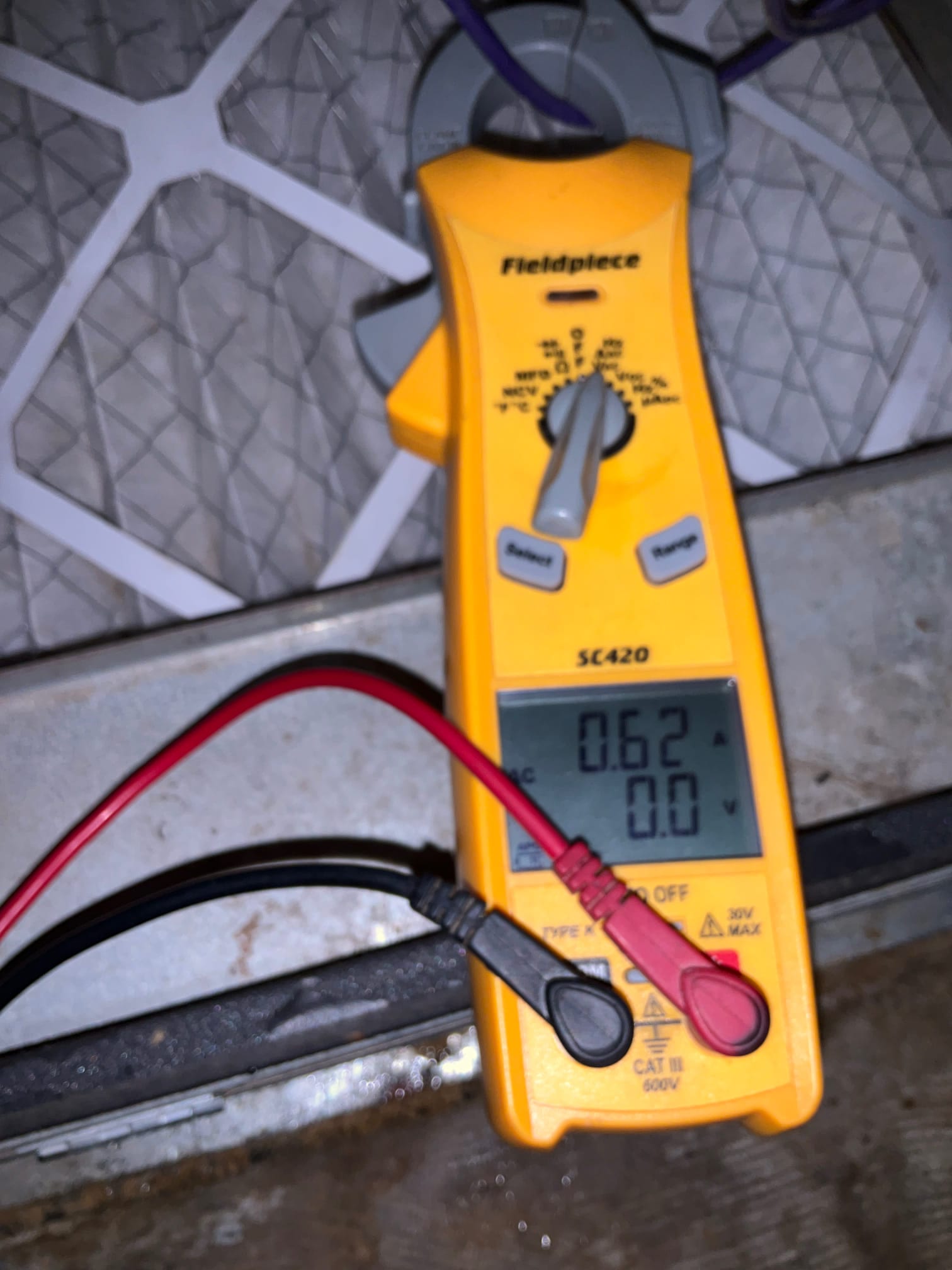 HVAC diagnostic instrument photographed during the service visit.