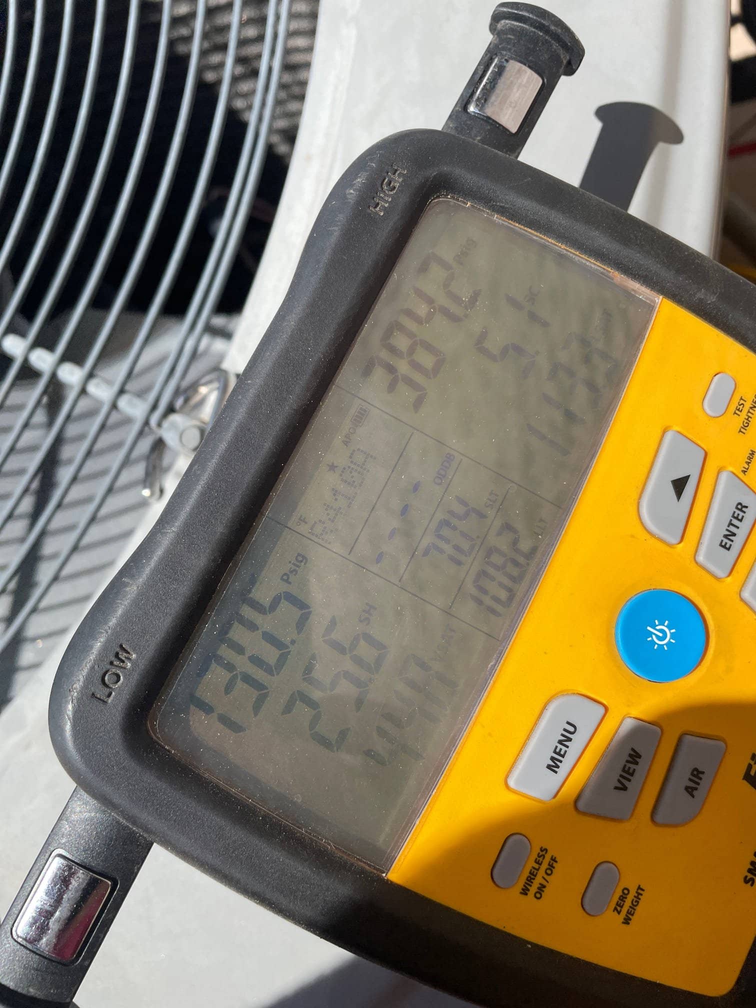 HVAC diagnostic instrument photographed during the service visit.