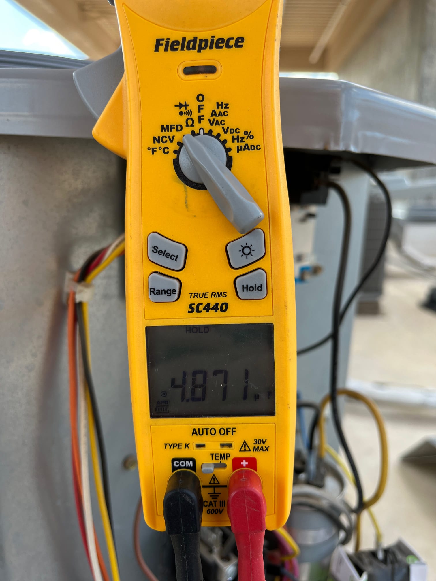 HVAC diagnostic instrument photographed during the service visit.
