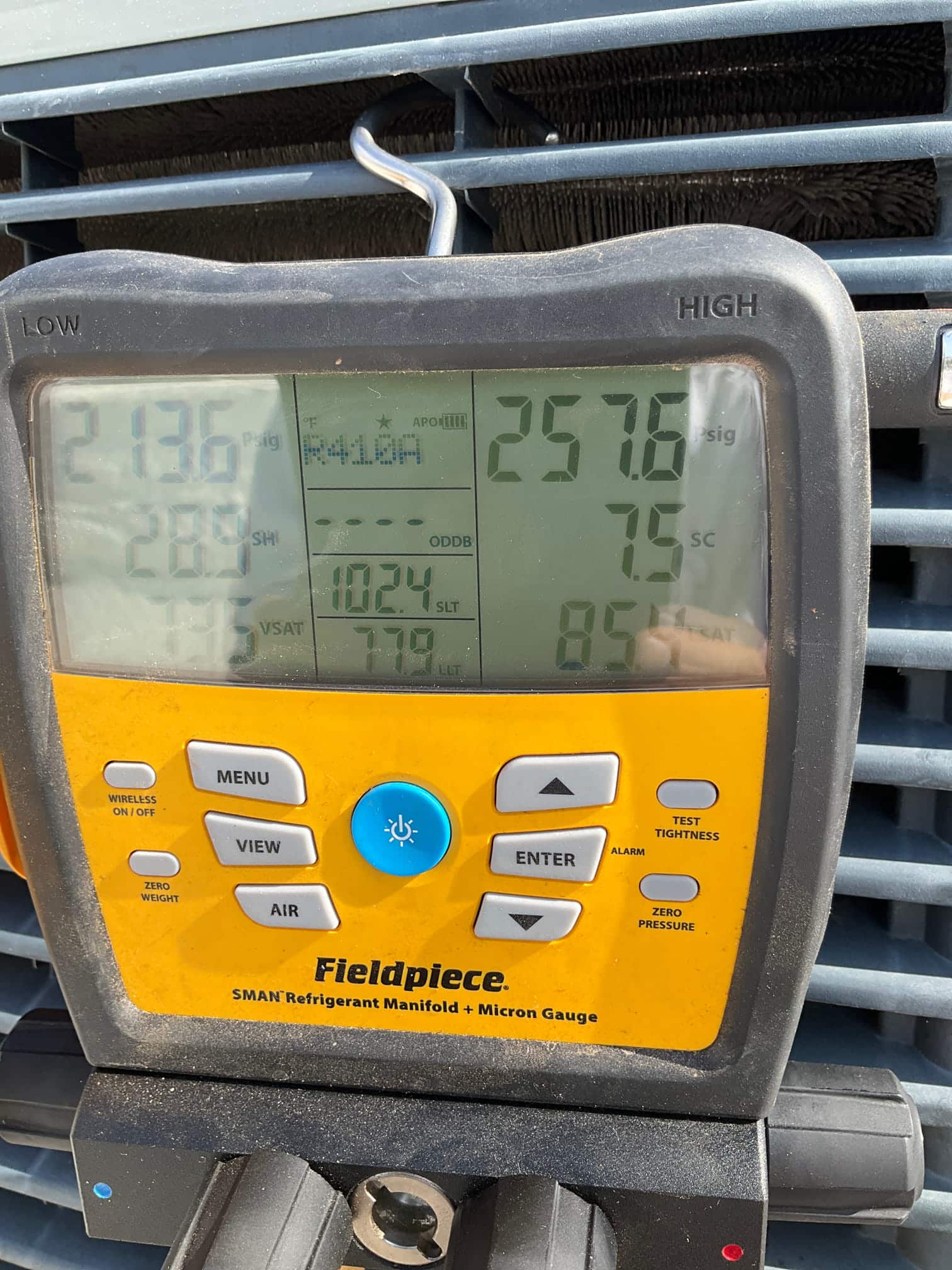 HVAC diagnostic instrument photographed during the service visit.
