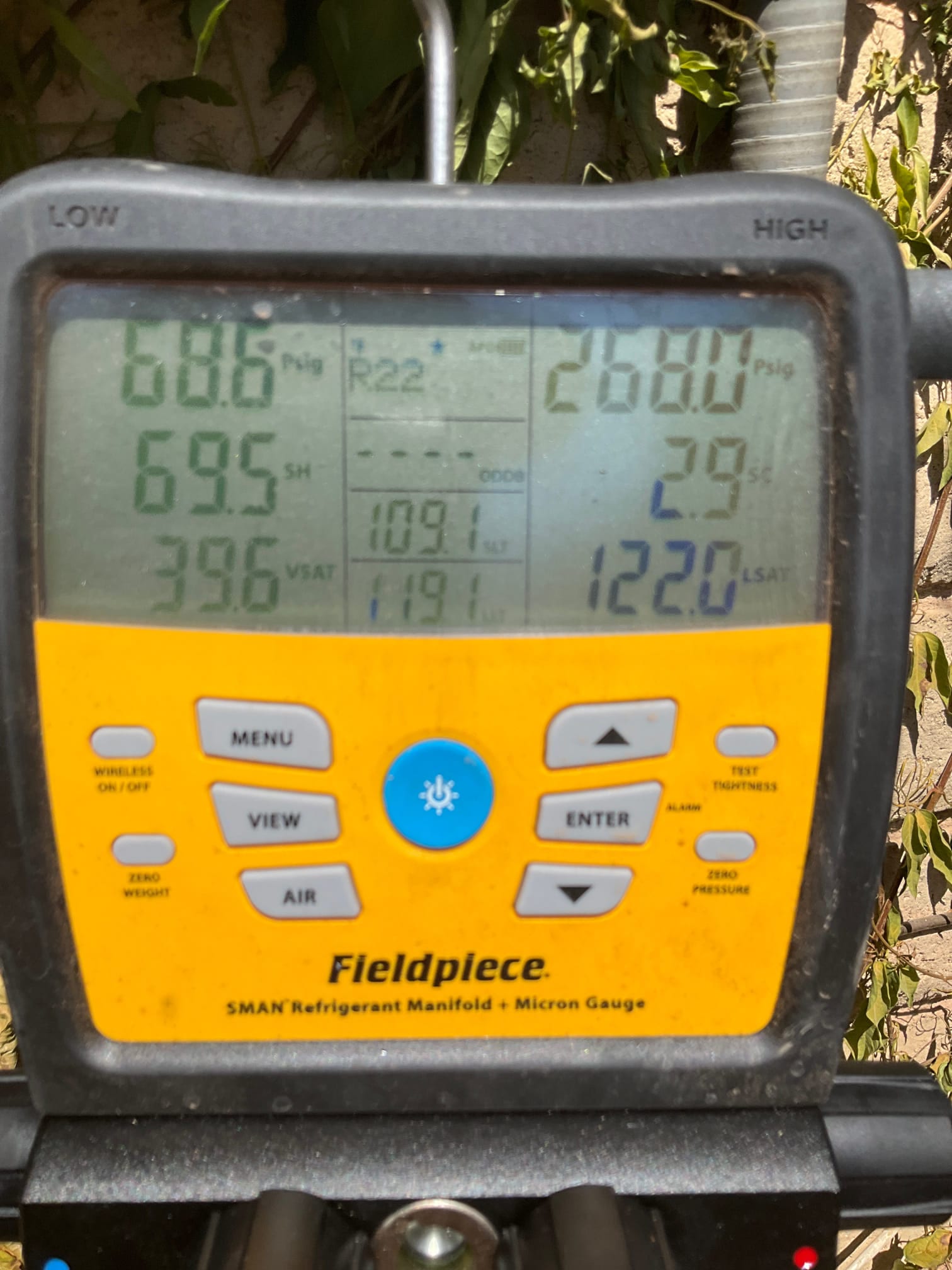 HVAC diagnostic instrument photographed during the service visit.