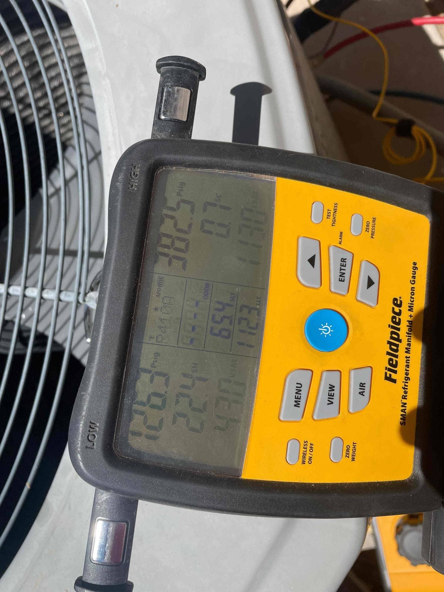 HVAC diagnostic instrument photographed during the service visit.