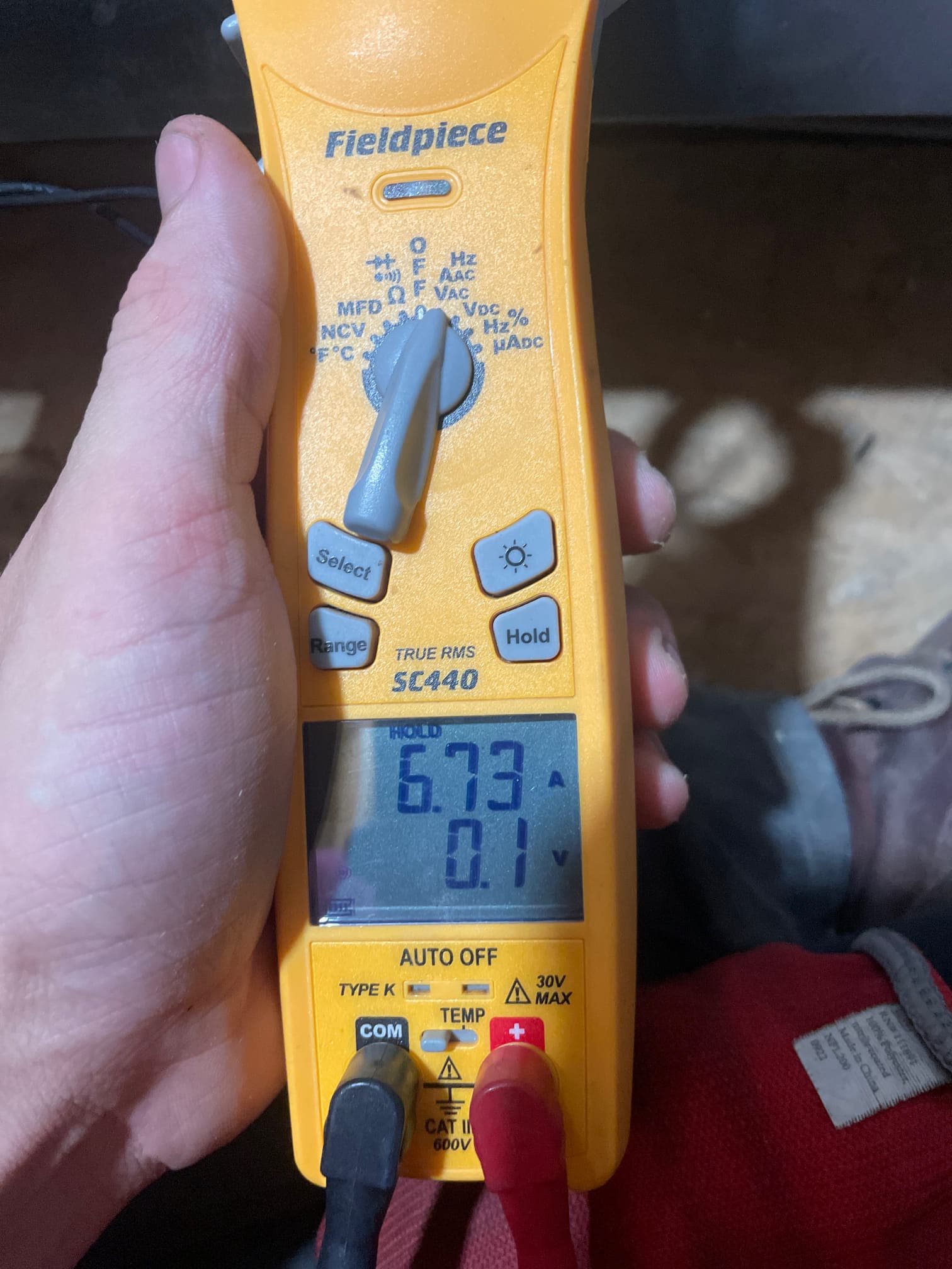 HVAC diagnostic instrument photographed during the service visit.