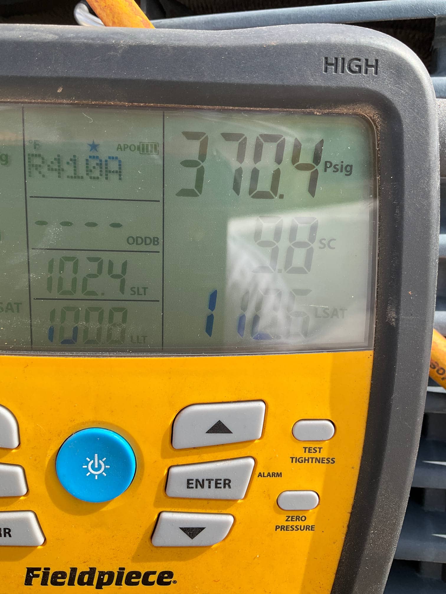 HVAC diagnostic instrument photographed during the service visit.