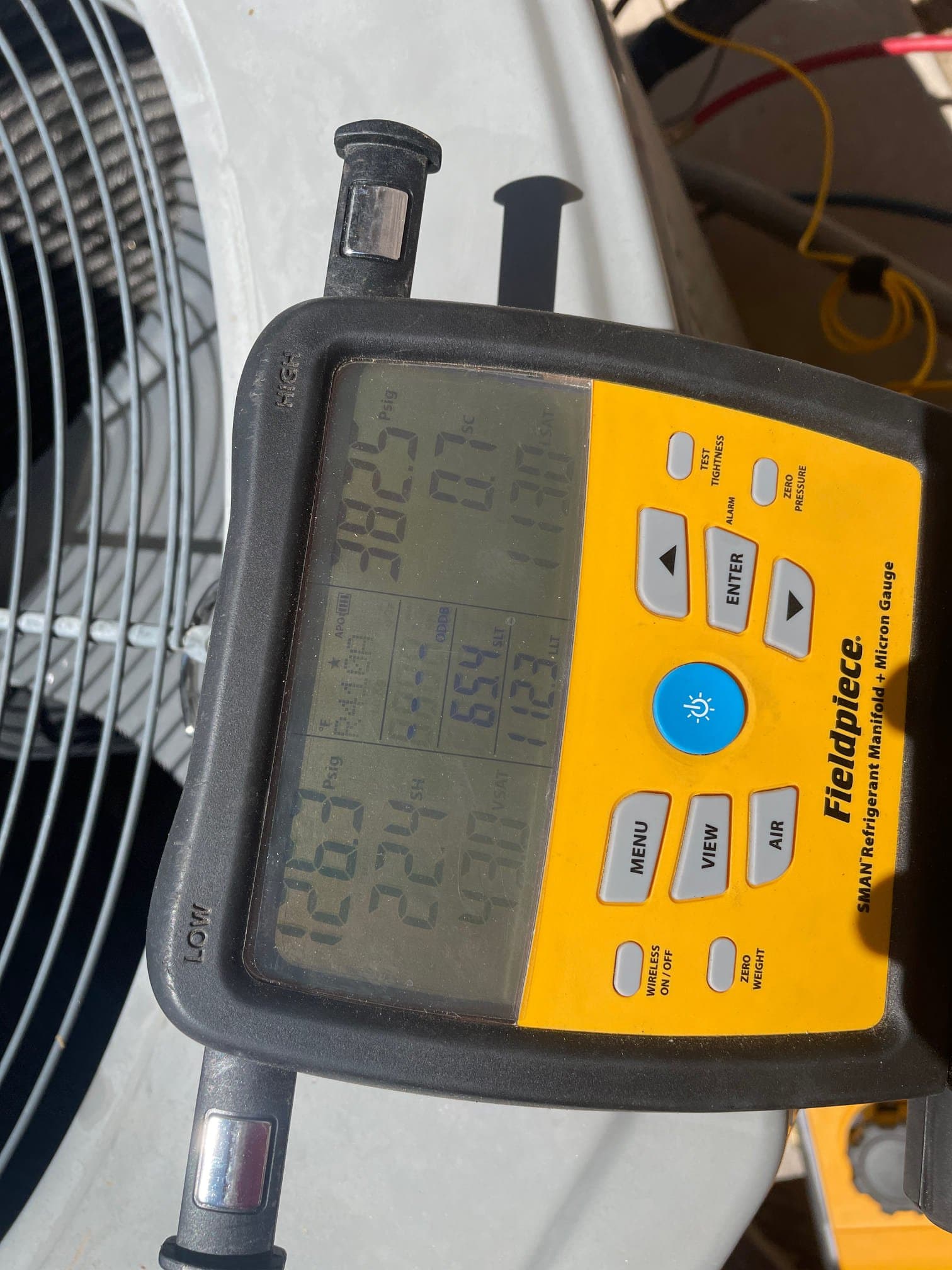 HVAC diagnostic instrument photographed during the service visit.