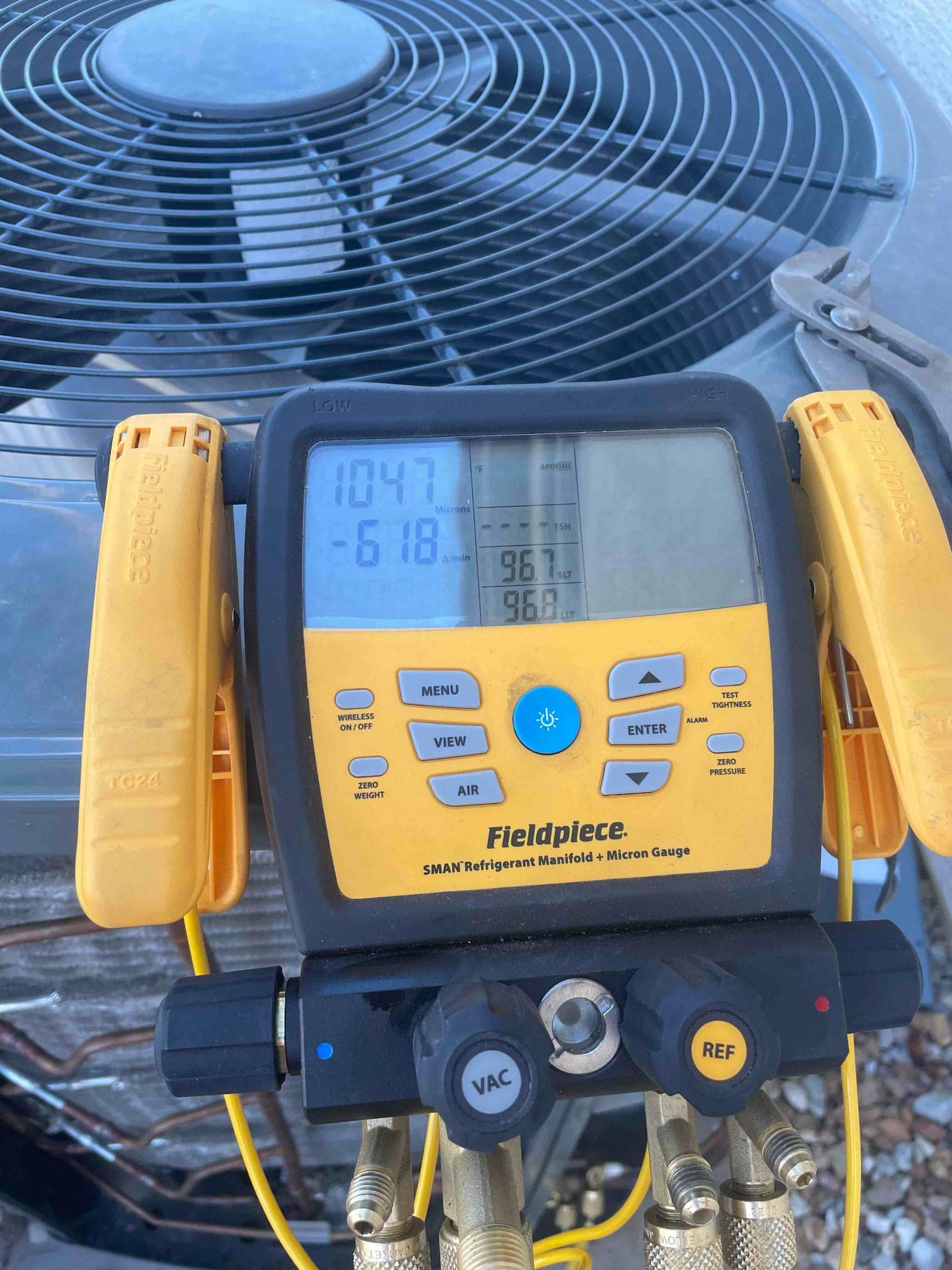 HVAC diagnostic instrument photographed during the service visit.