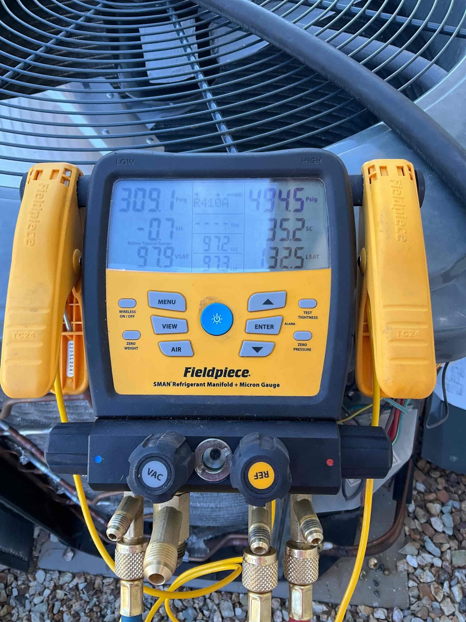 HVAC diagnostic instrument photographed during the service visit.