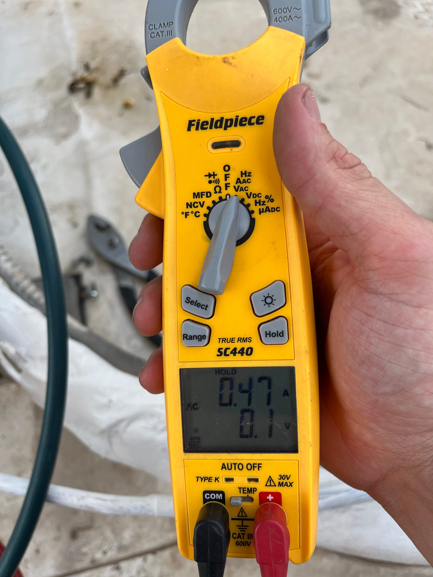 HVAC diagnostic instrument photographed during the service visit.