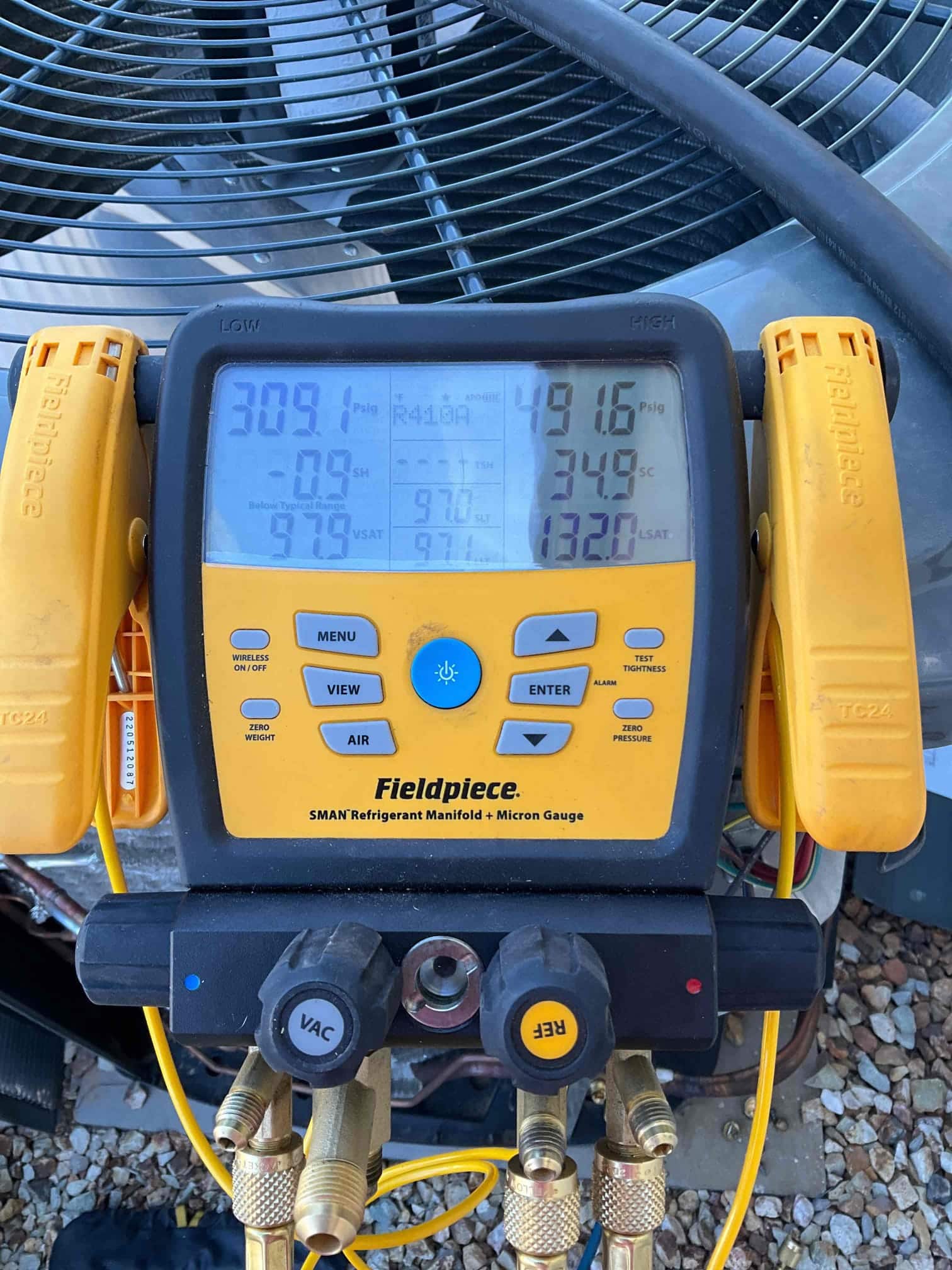 HVAC diagnostic instrument photographed during the service visit.