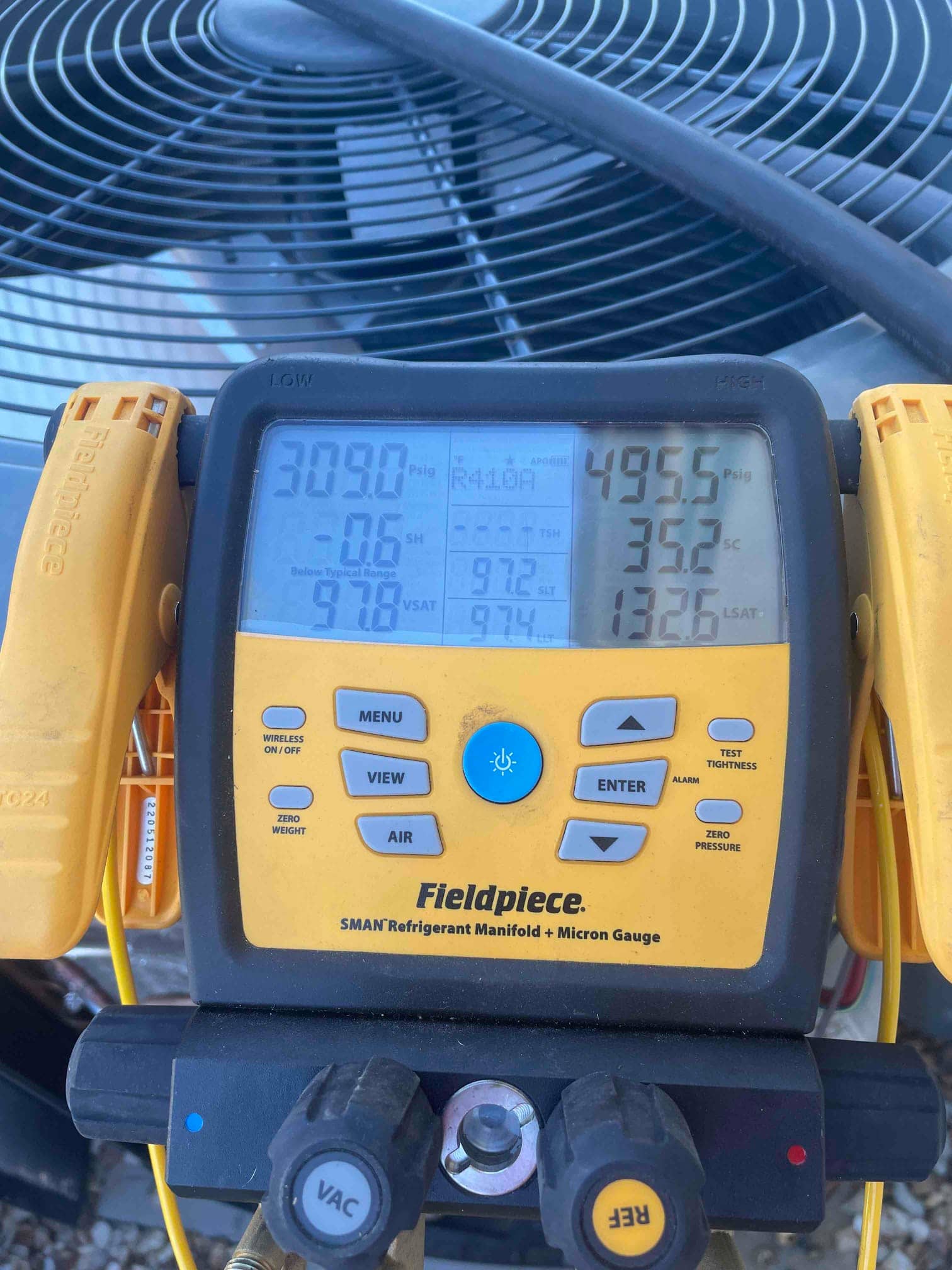 HVAC diagnostic instrument photographed during the service visit.