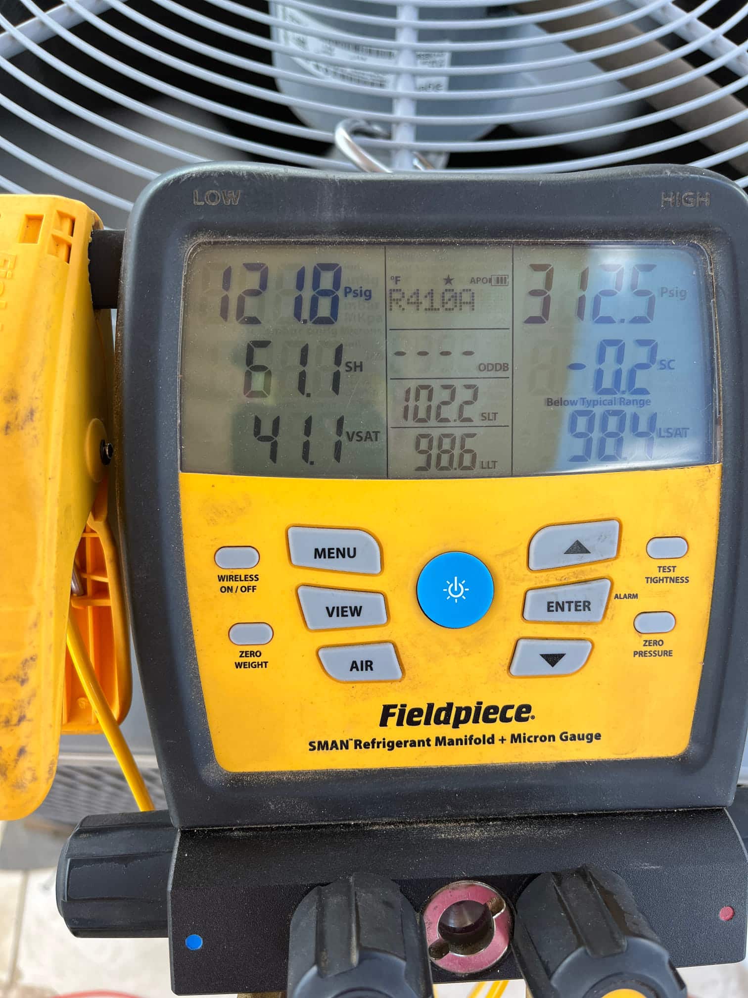 HVAC diagnostic instrument photographed during the service visit.