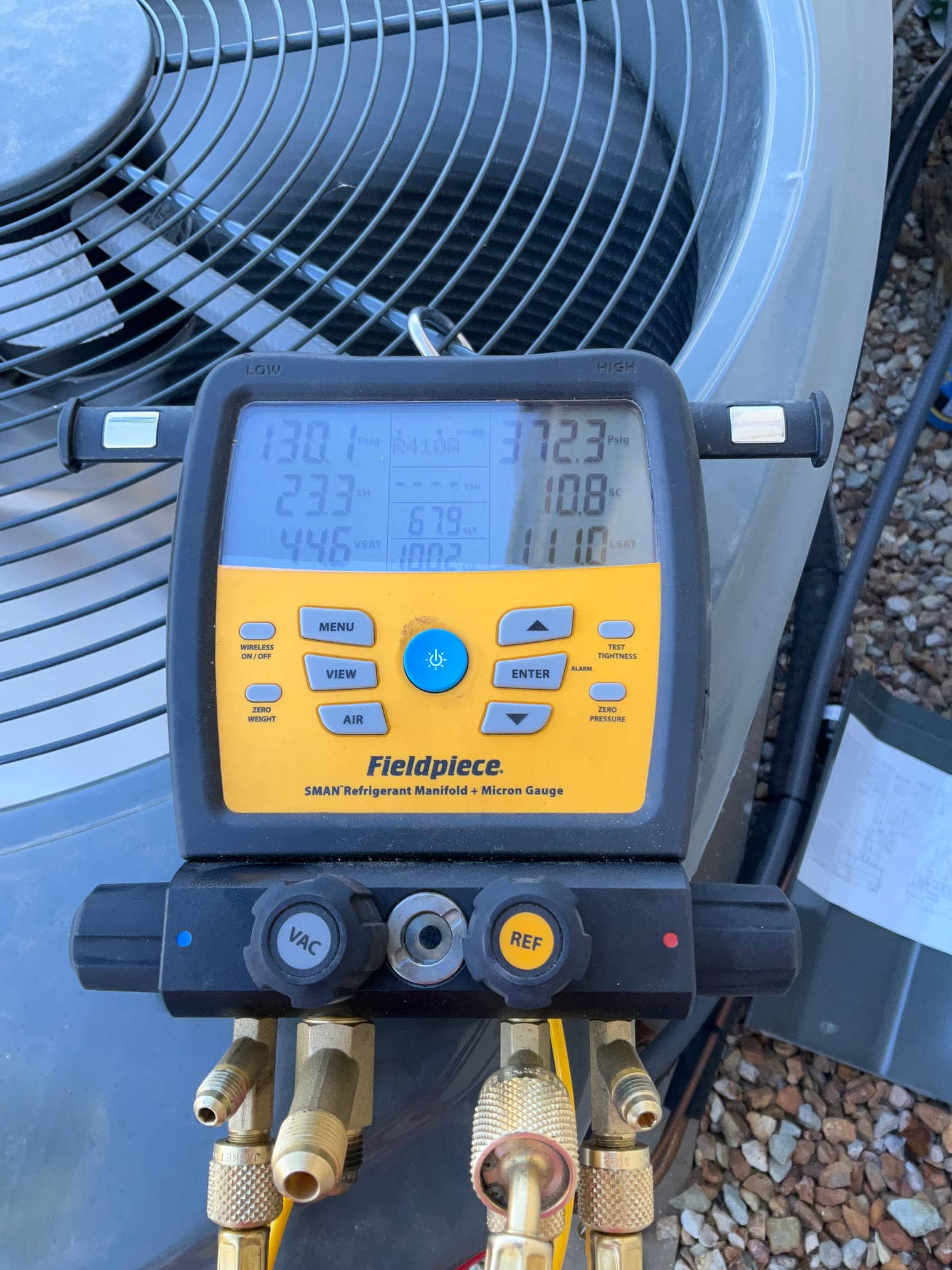 HVAC diagnostic instrument photographed during the service visit.