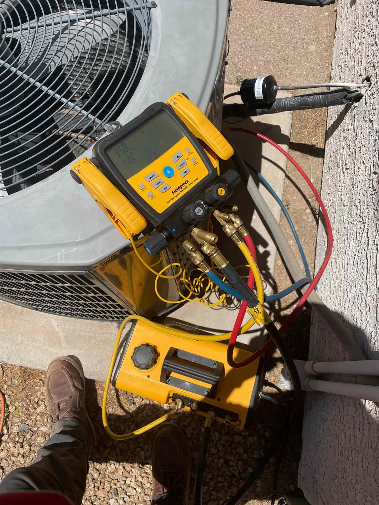 HVAC diagnostic instrument photographed during the service visit.