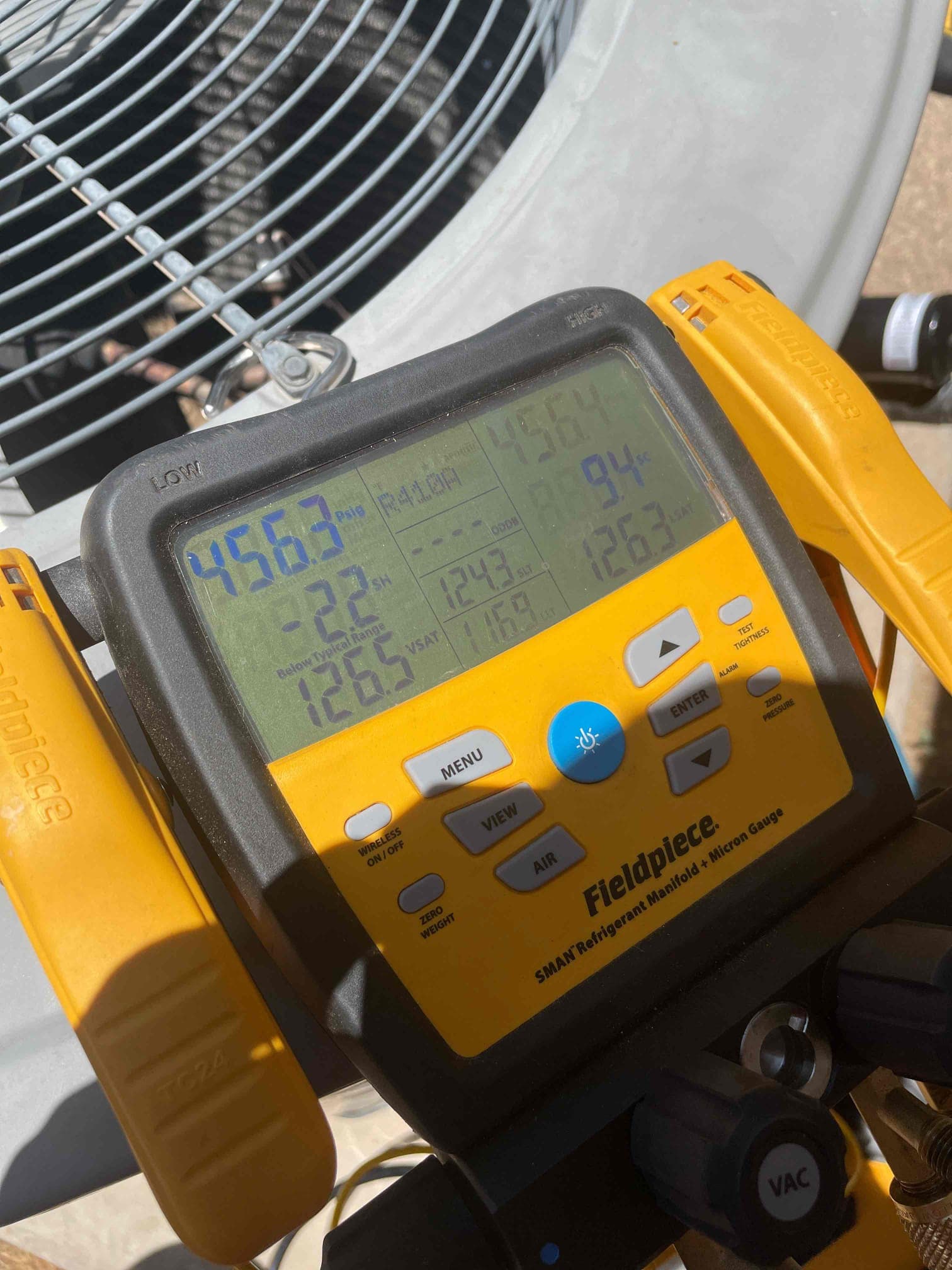 HVAC diagnostic instrument photographed during the service visit.