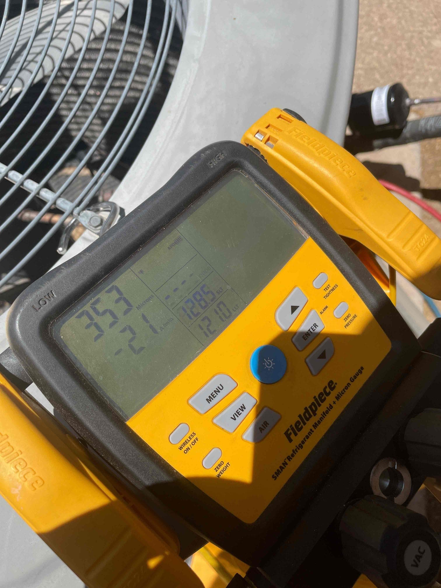 HVAC diagnostic instrument photographed during the service visit.
