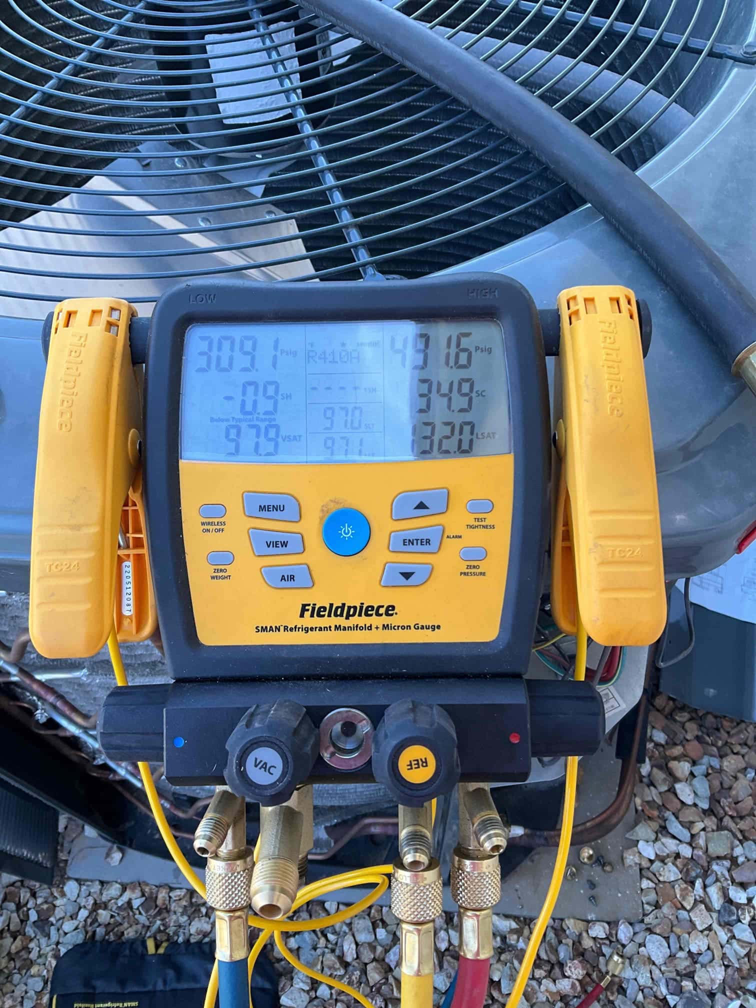 HVAC diagnostic instrument photographed during the service visit.
