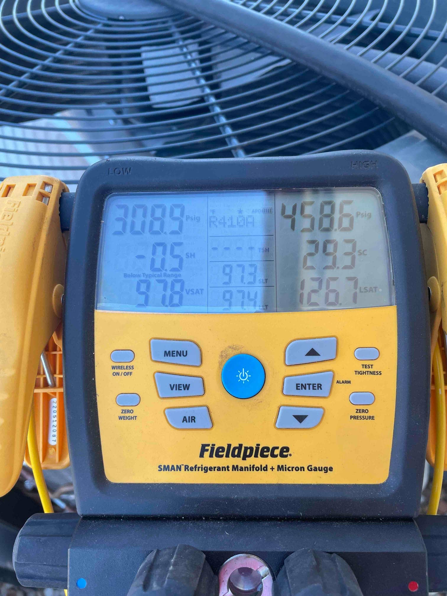 HVAC diagnostic instrument photographed during the service visit.