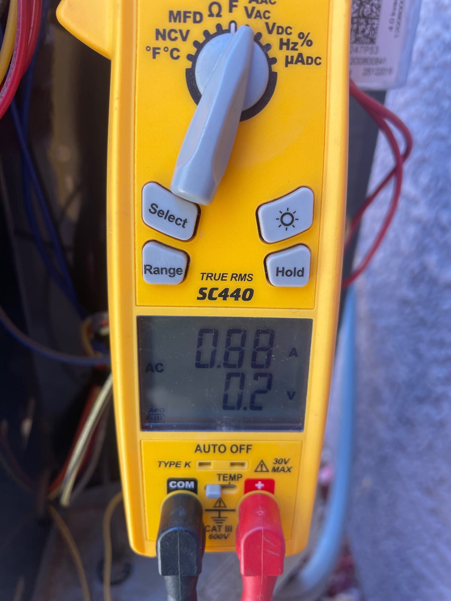 HVAC diagnostic instrument photographed during the service visit.
